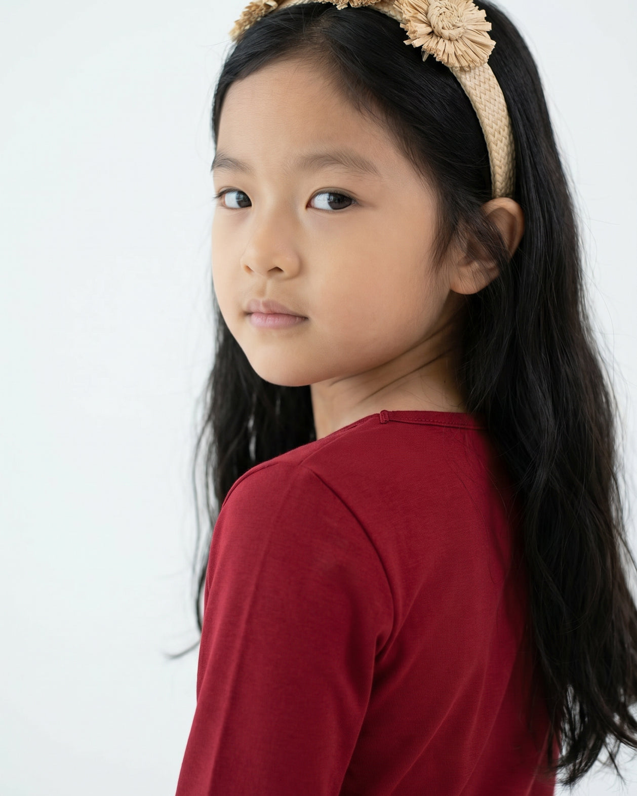 Model wearing the Girls' Nuggles® Essential 3/4 Tee in Brick Red