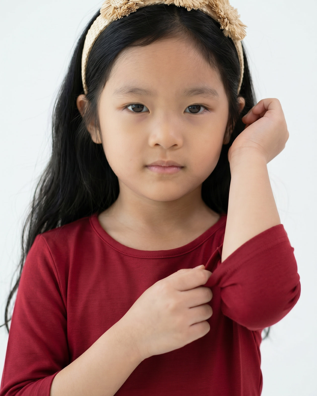 Model wearing the Girls' Nuggles® Essential 3/4 Tee in Brick Red