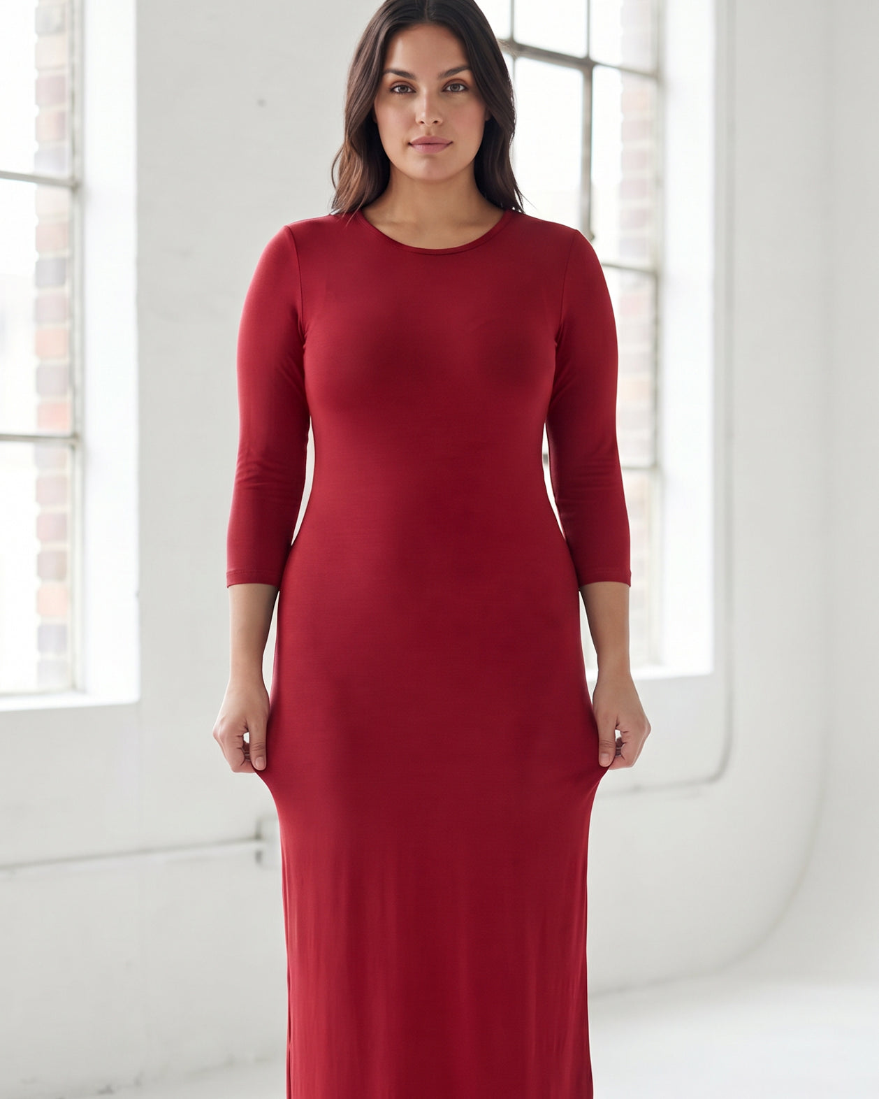 Model wearing Nuggles® Maxi Layering Dress in Brick Red