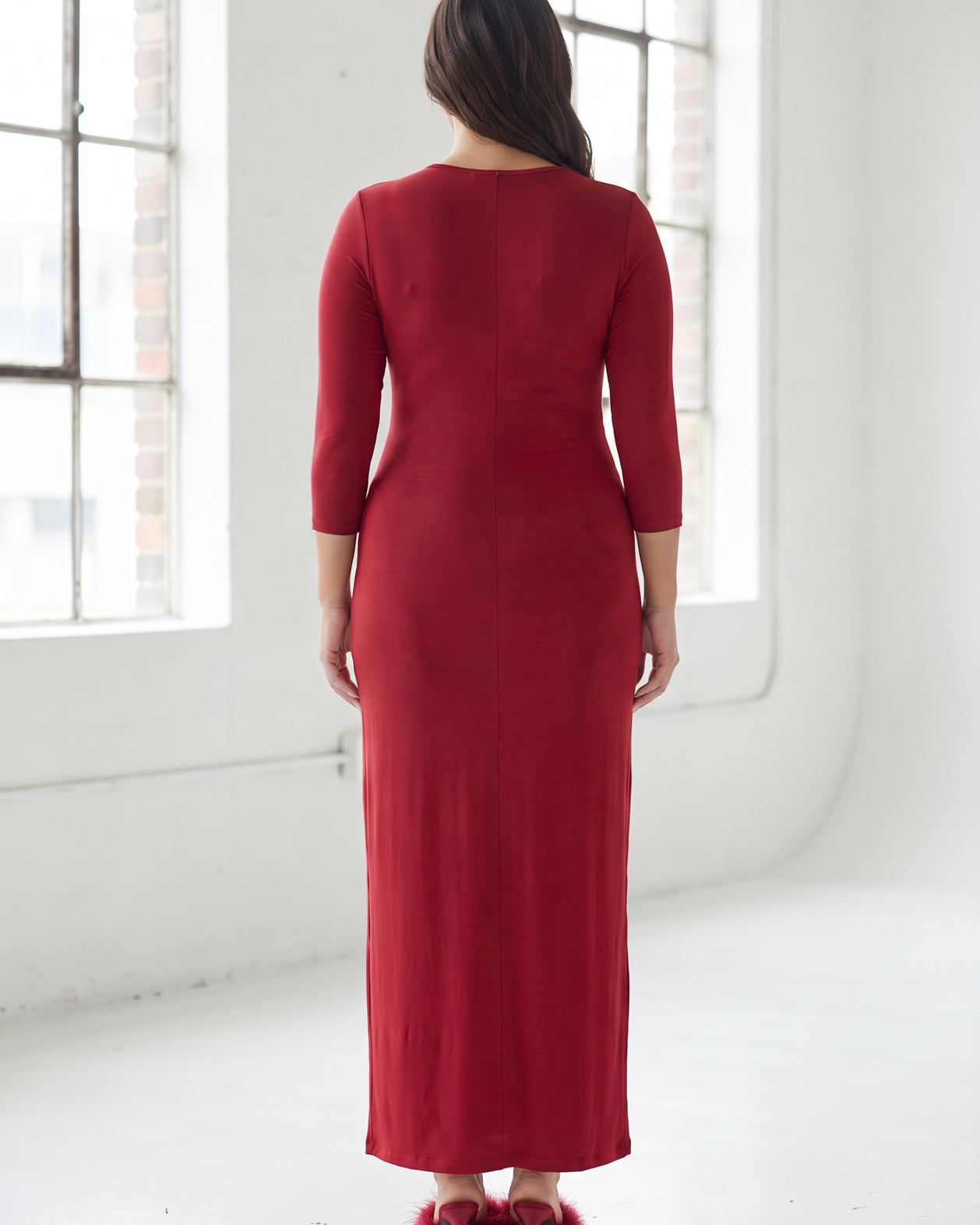 Model wearing Nuggles® Maxi Layering Dress in Brick Red