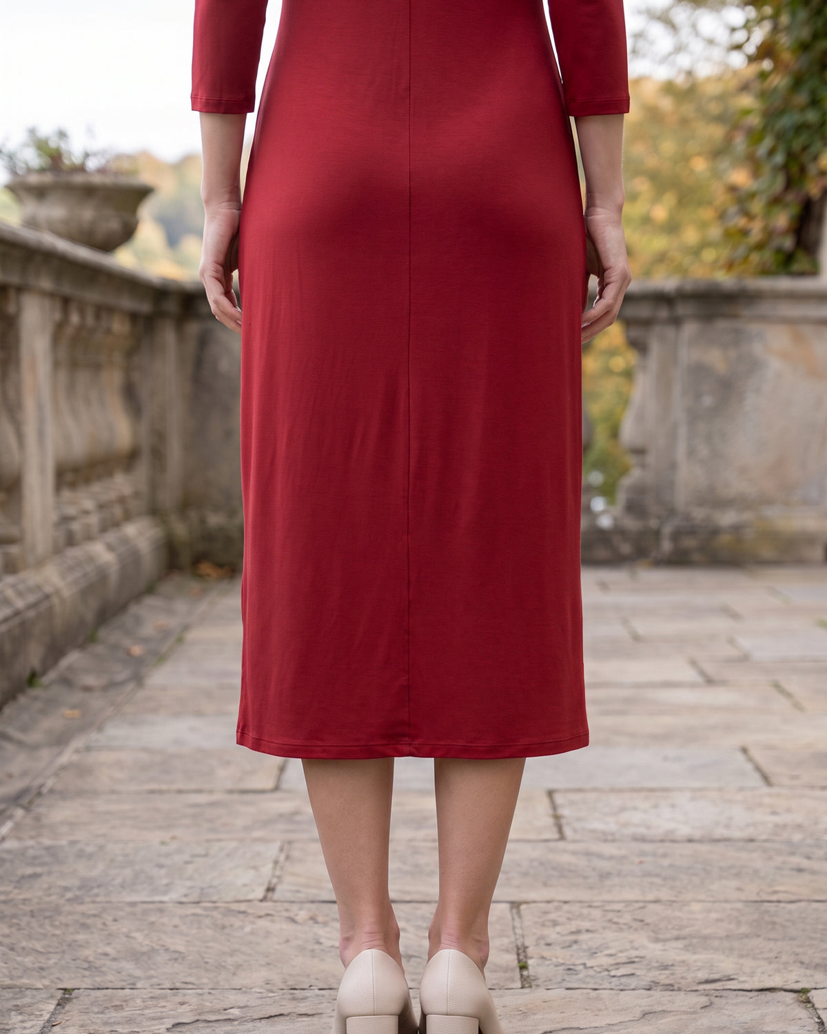 Model wearing Nuggles® Midi Layering Dress in Brick Red