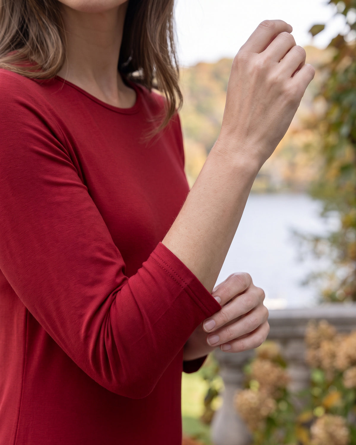 Model wearing Nuggles® Midi Layering Dress in Brick Red