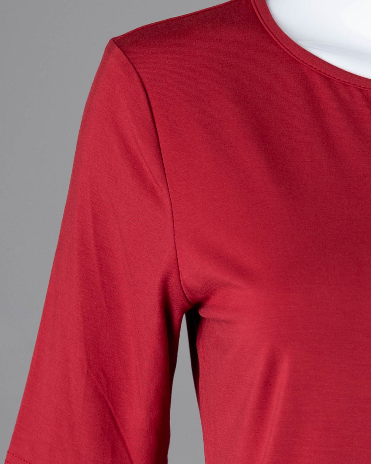 Model wearing Nuggles® Half Sleeve Essential Tee in Brick Red