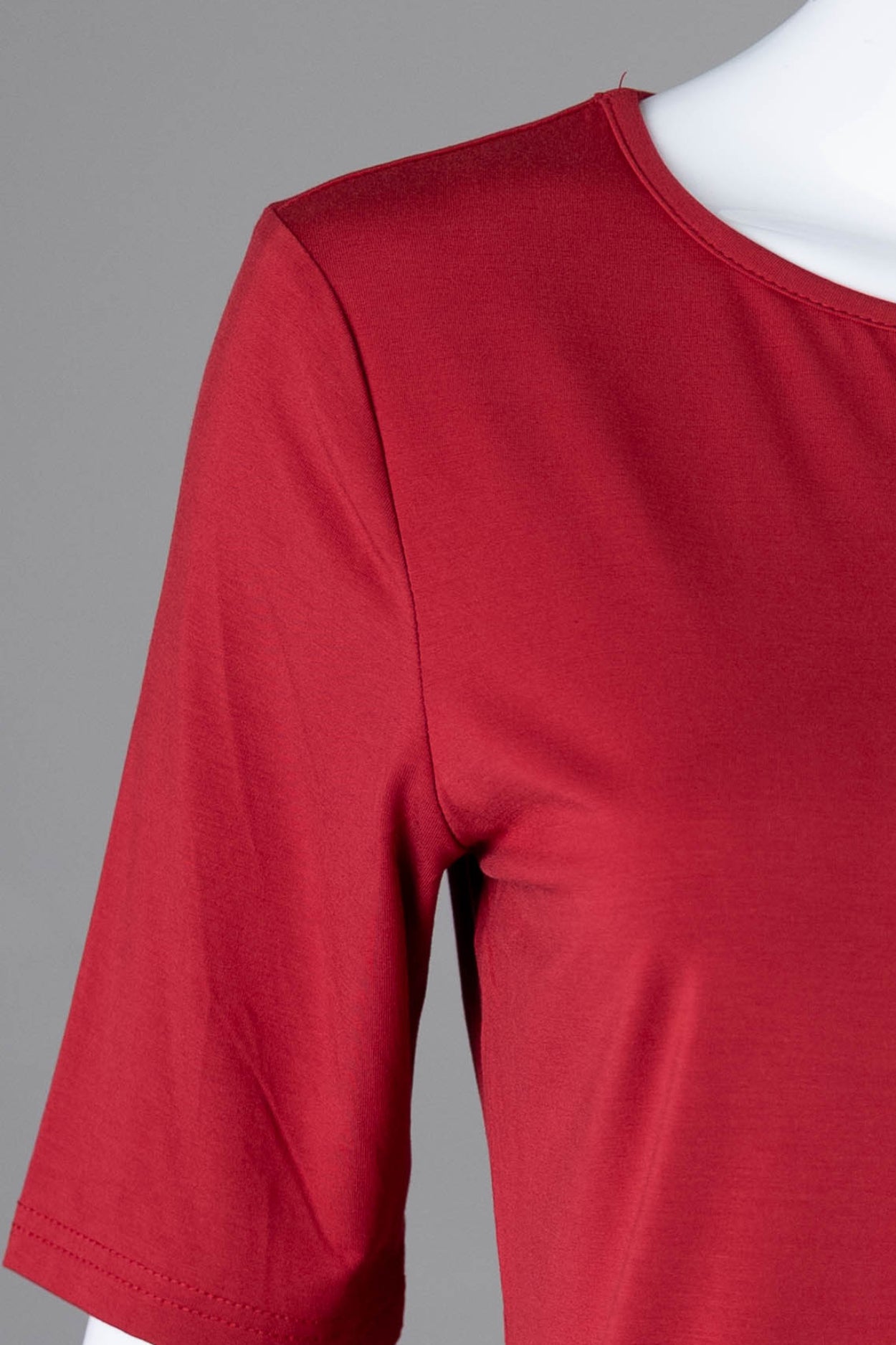Model wearing Nuggles® Half Sleeve Essential Tee in Brick Red