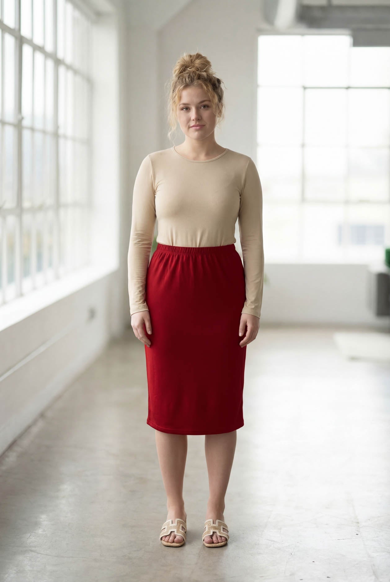Model wearing Nuggles® 27" Classic Skirt in Brick Red