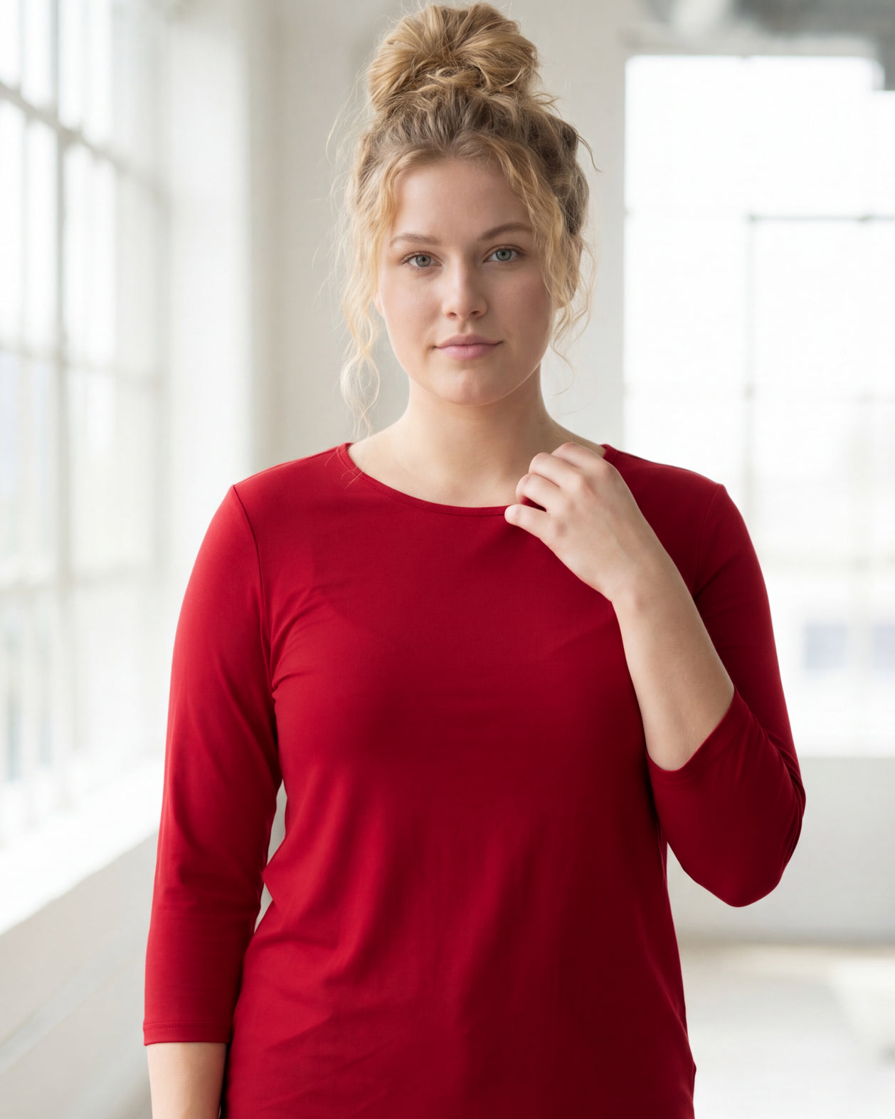 Model wearing Nuggles® 3/4 Essential Tee in Brick Red