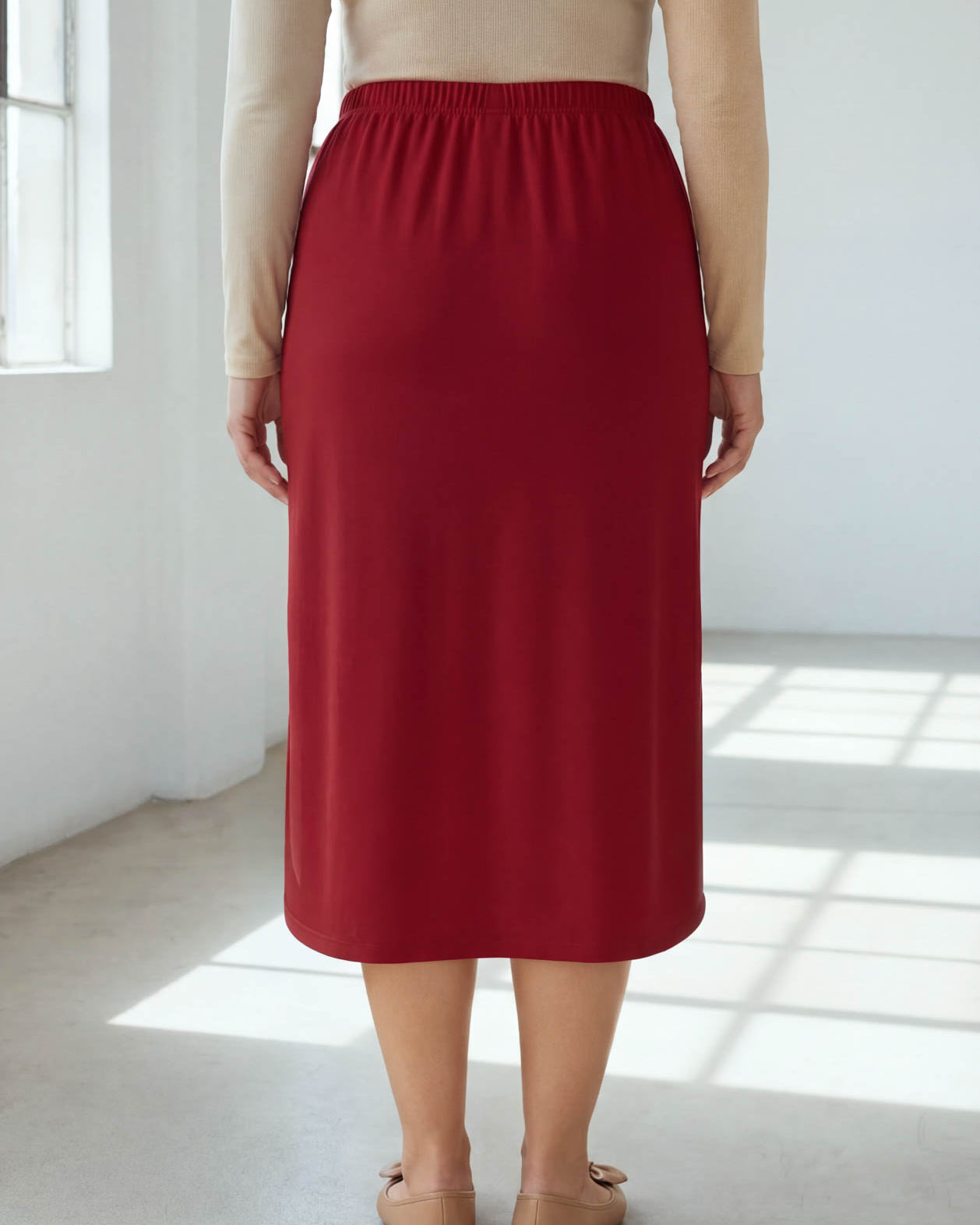 Model wearing Nuggles® 31" Classic Skirt in Brick Red