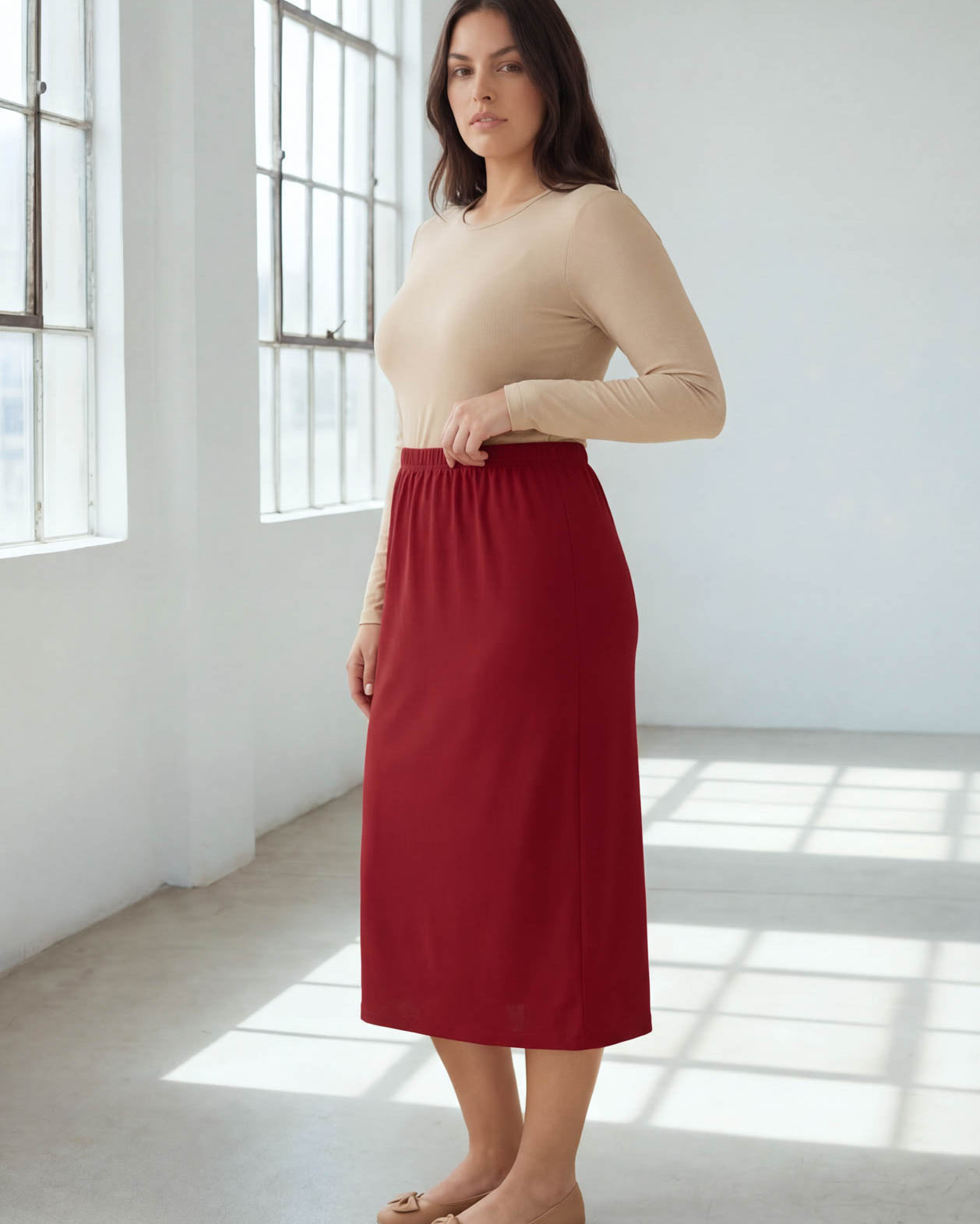 Model wearing Nuggles® 31" Classic Skirt in Brick Red