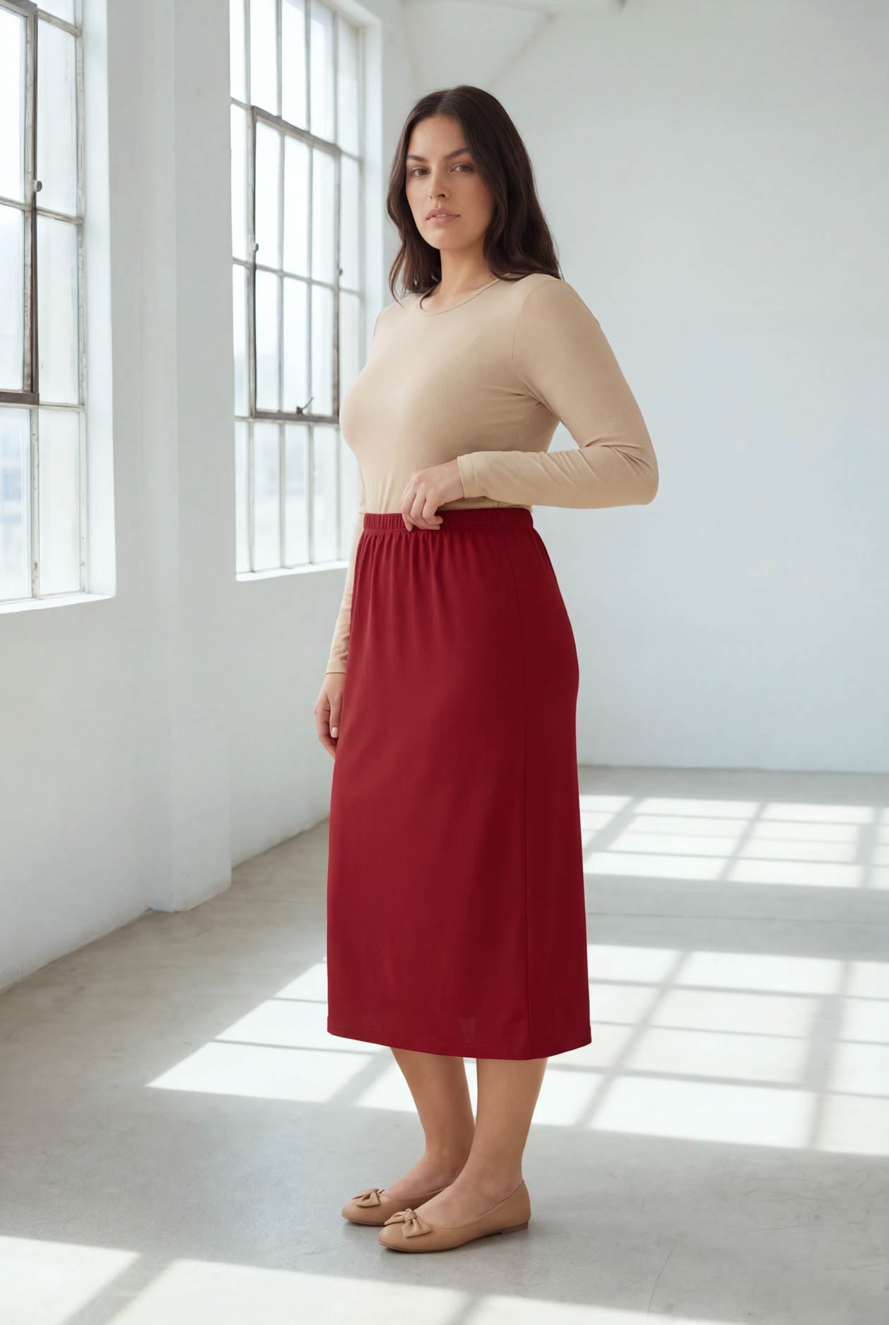 Model wearing Nuggles® 31" Classic Skirt in Brick Red