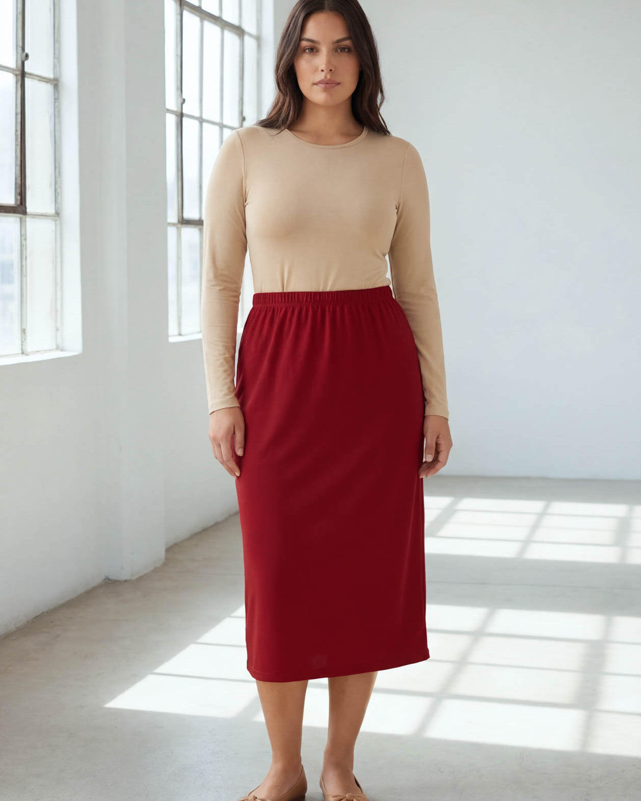 Model wearing Nuggles® 31" Classic Skirt in Brick Red