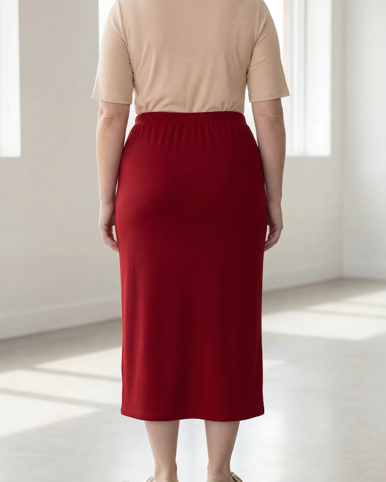 Model wearing Nuggles® 34" Classic Skirt in Brick Red