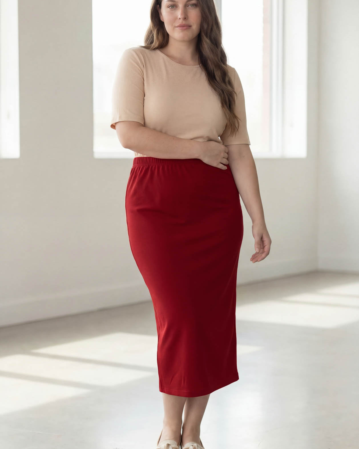 Model wearing Nuggles® 34" Classic Skirt in Brick Red