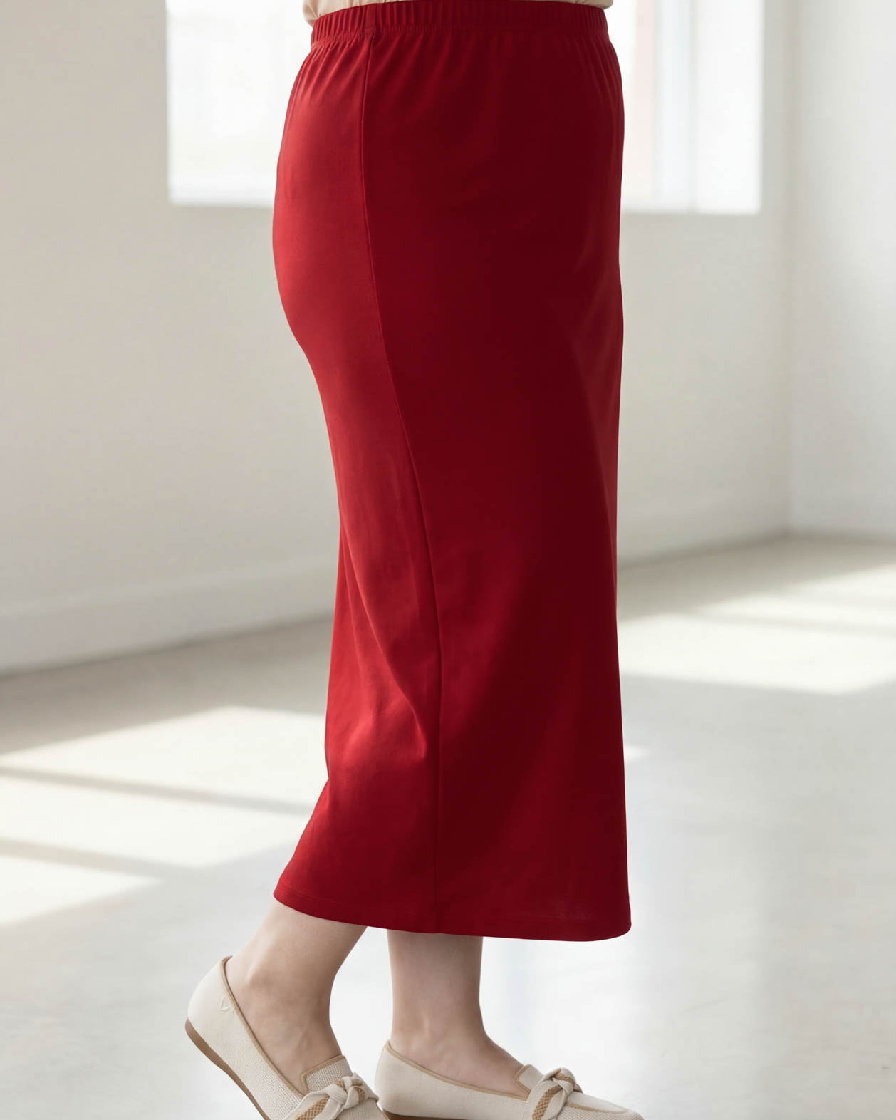 Model wearing Nuggles® 34" Classic Skirt in Brick Red