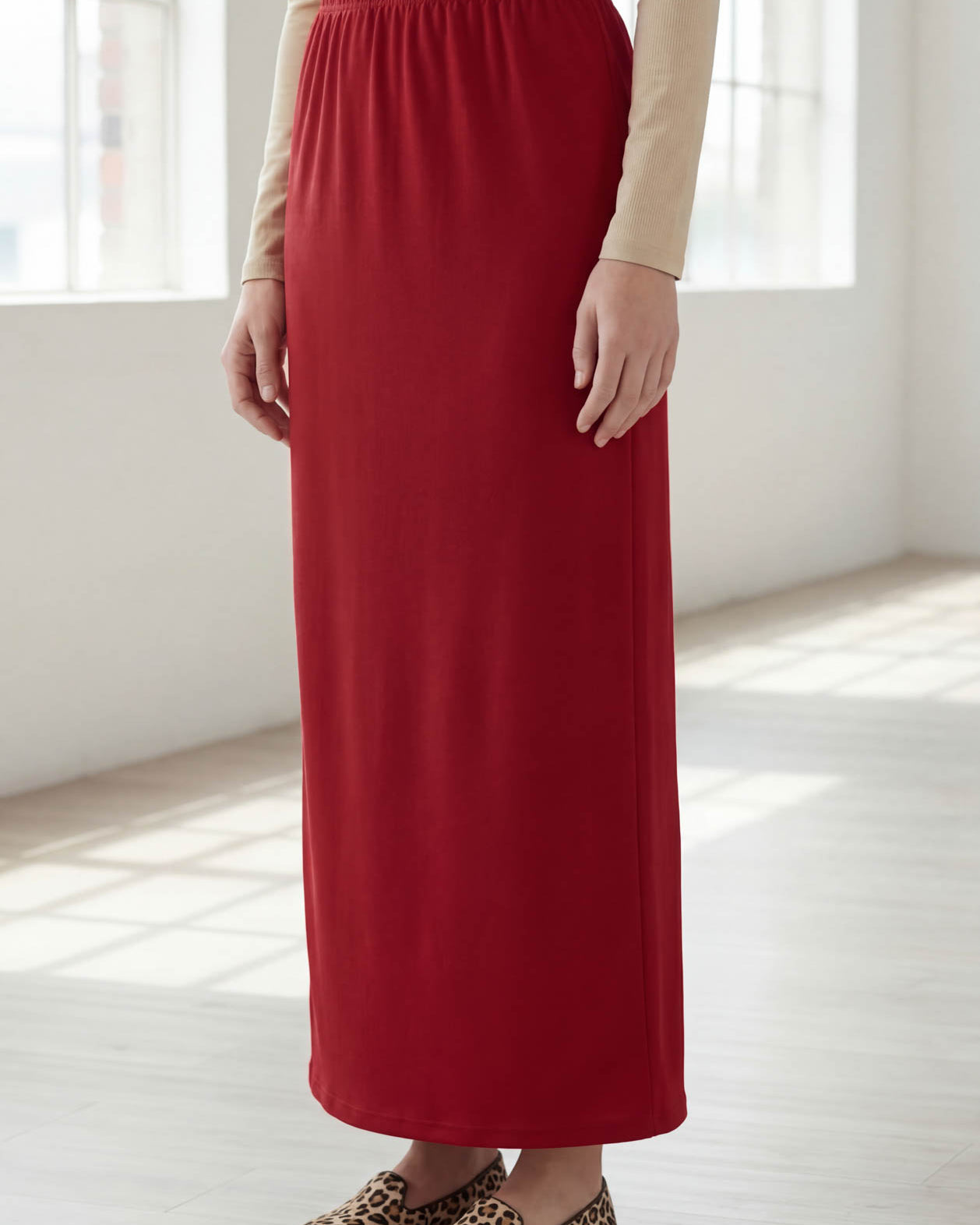 Model wearing Nuggles® 36" Classic Skirt in Brick Red