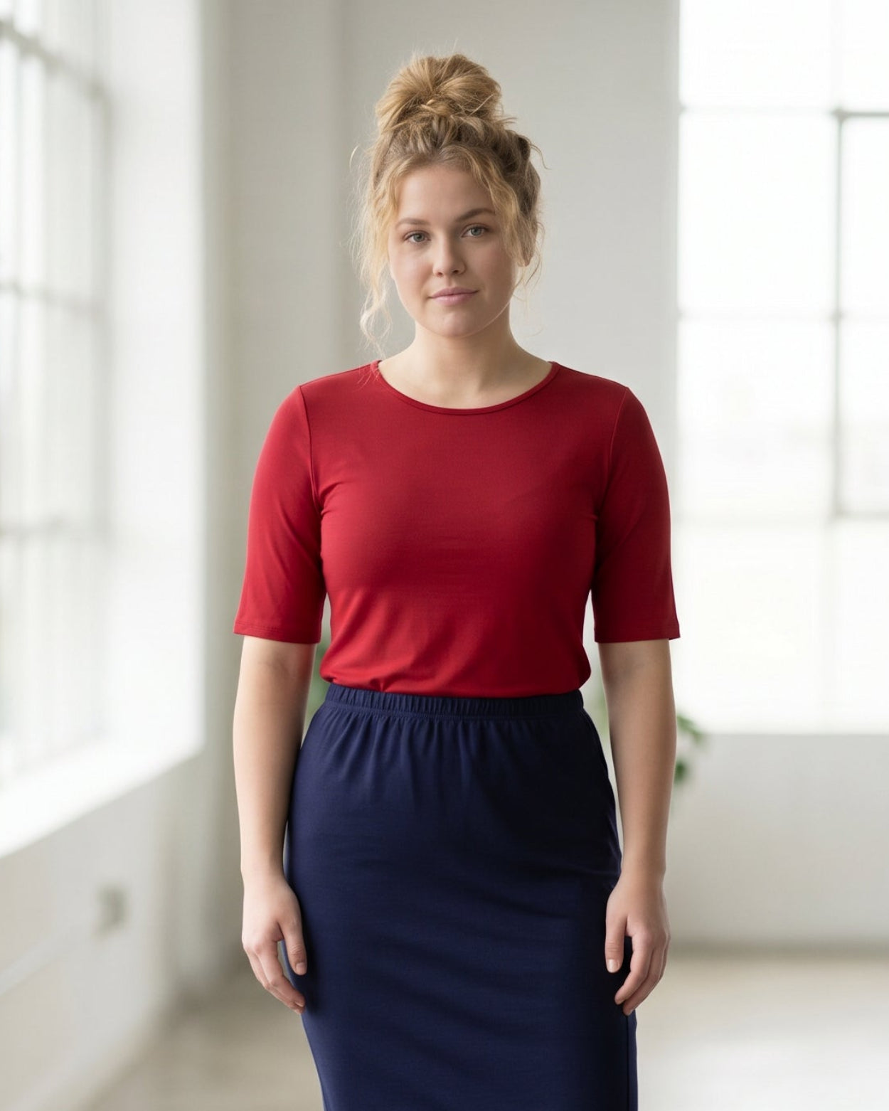 Model wearing the Nuggles® Essential Half Sleeve Tee in Brick Red
