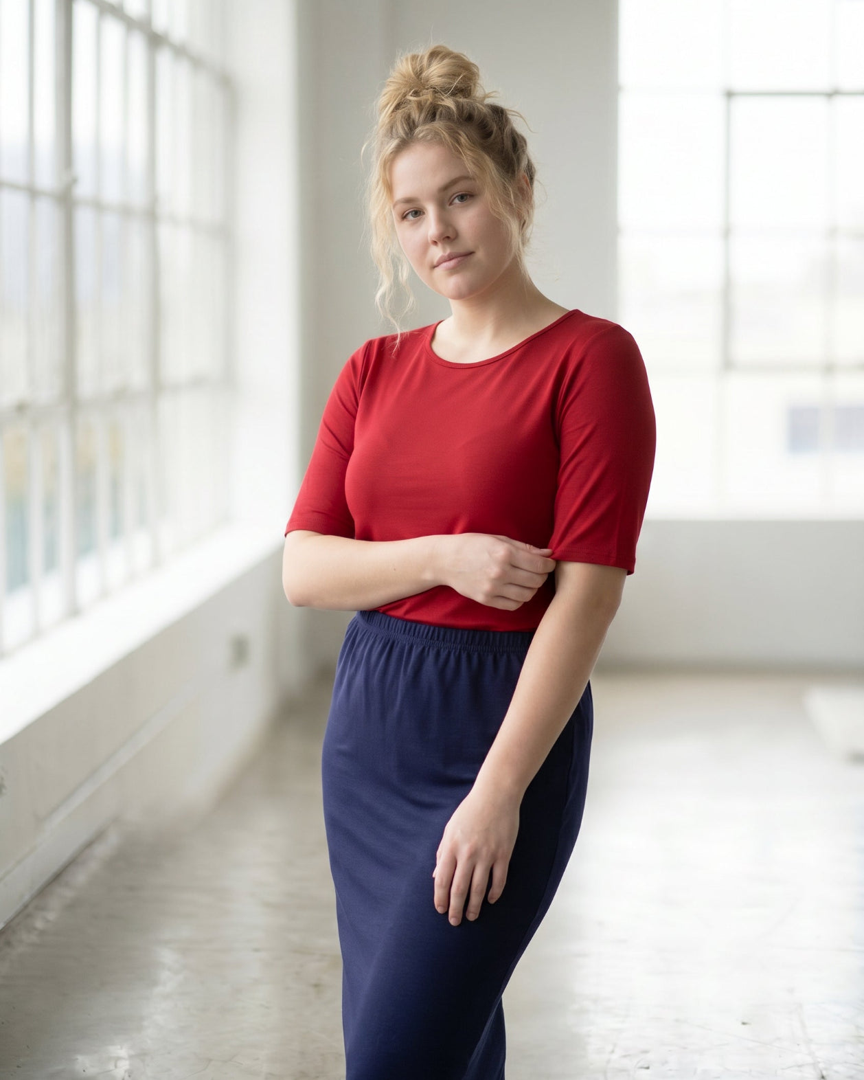Model wearing Nuggles® Half Sleeve Essential Tee in Brick Red