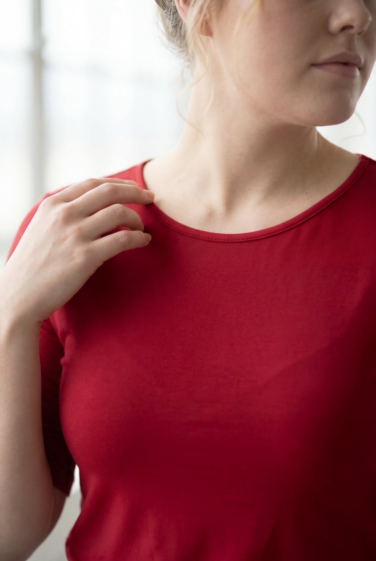 Model wearing Nuggles® Half Sleeve Essential Tee in Brick Red