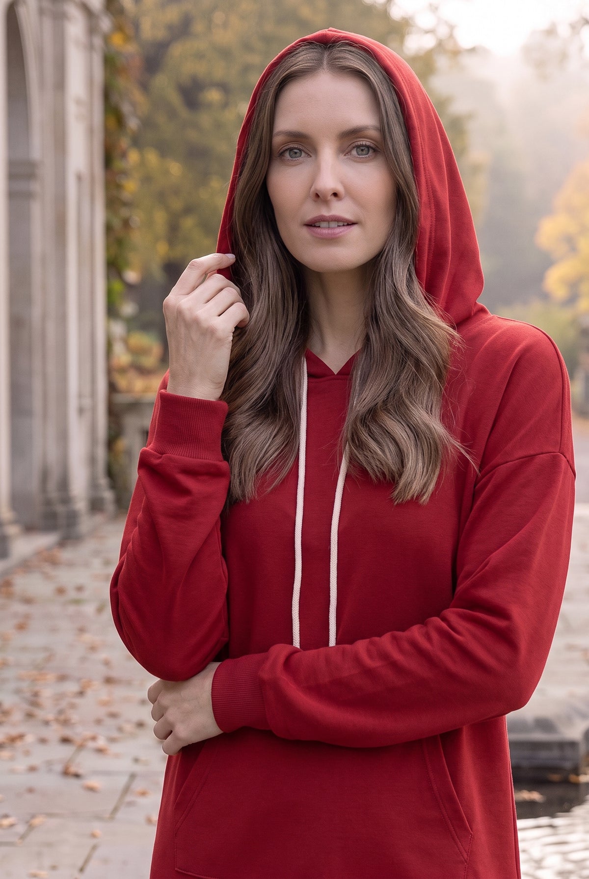Model wearing Nuggles® Hoodie Dress in Brick Red