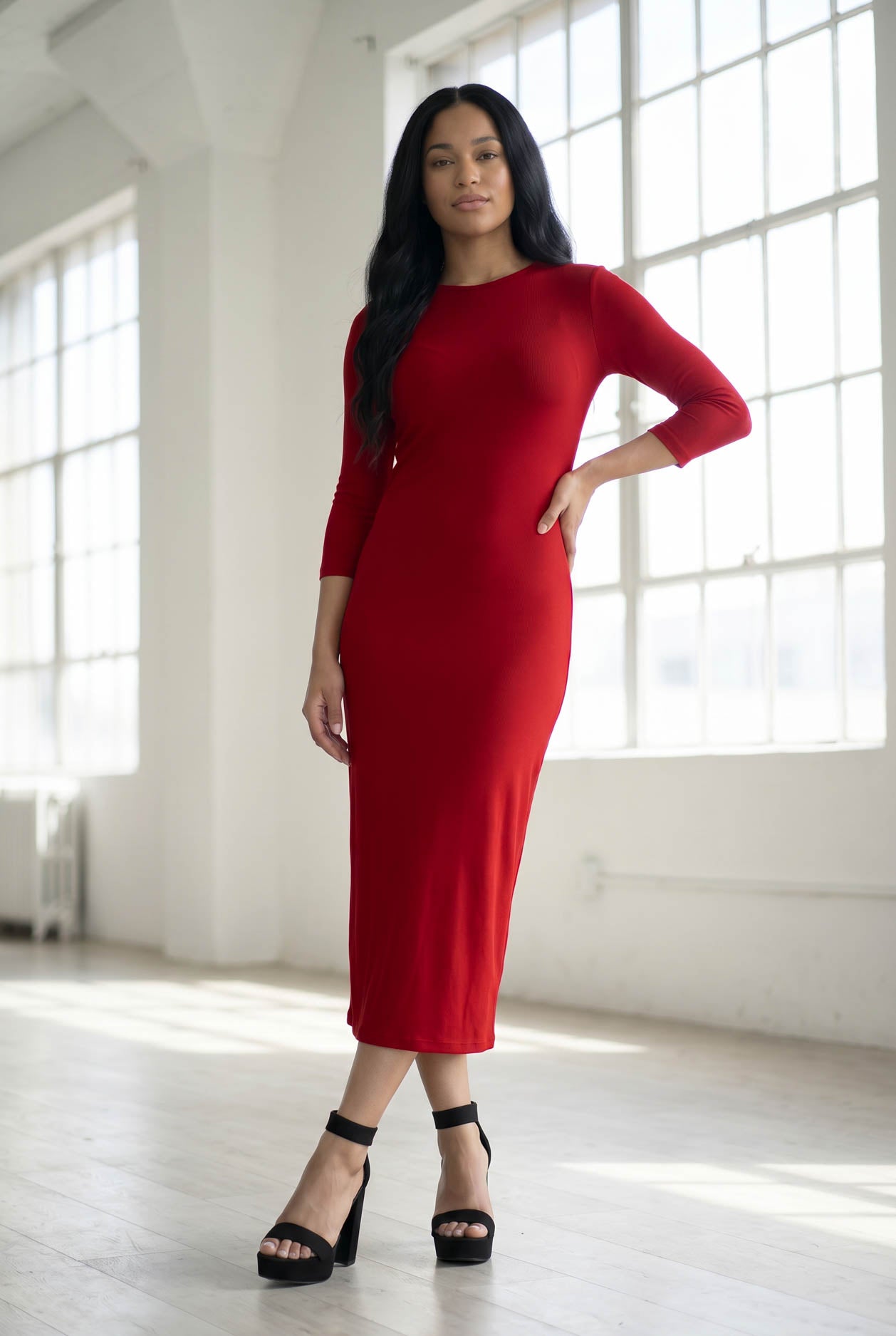 Model wearing Nuggles® Ribbed Layering Dress in Brick Red