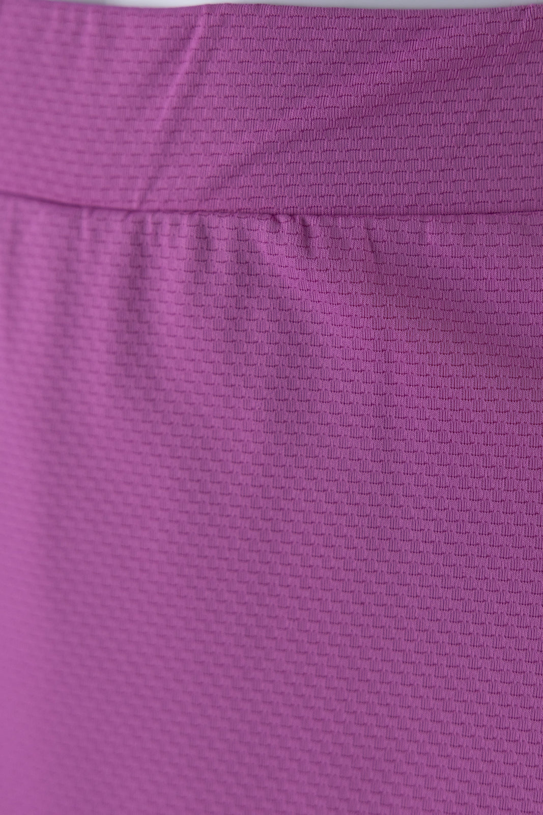 Model wearing Nuggles® 27" All-Sport Skirt in Bubble Gum