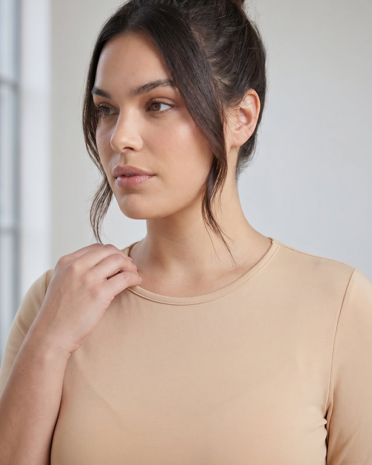 Model wearing Nuggles® 3/4 Essential Tee in Buff