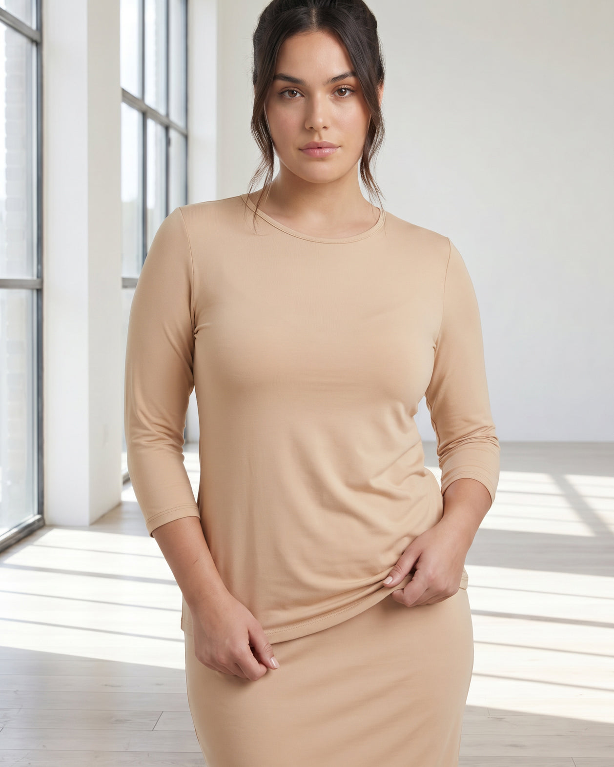 Model wearing Nuggles® 3/4 Essential Tee in Buff