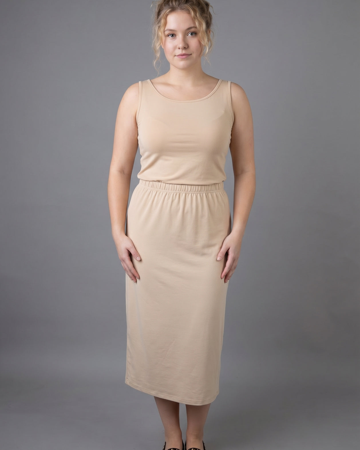Model wearing Nuggles® Wide Neck Tank in Buff