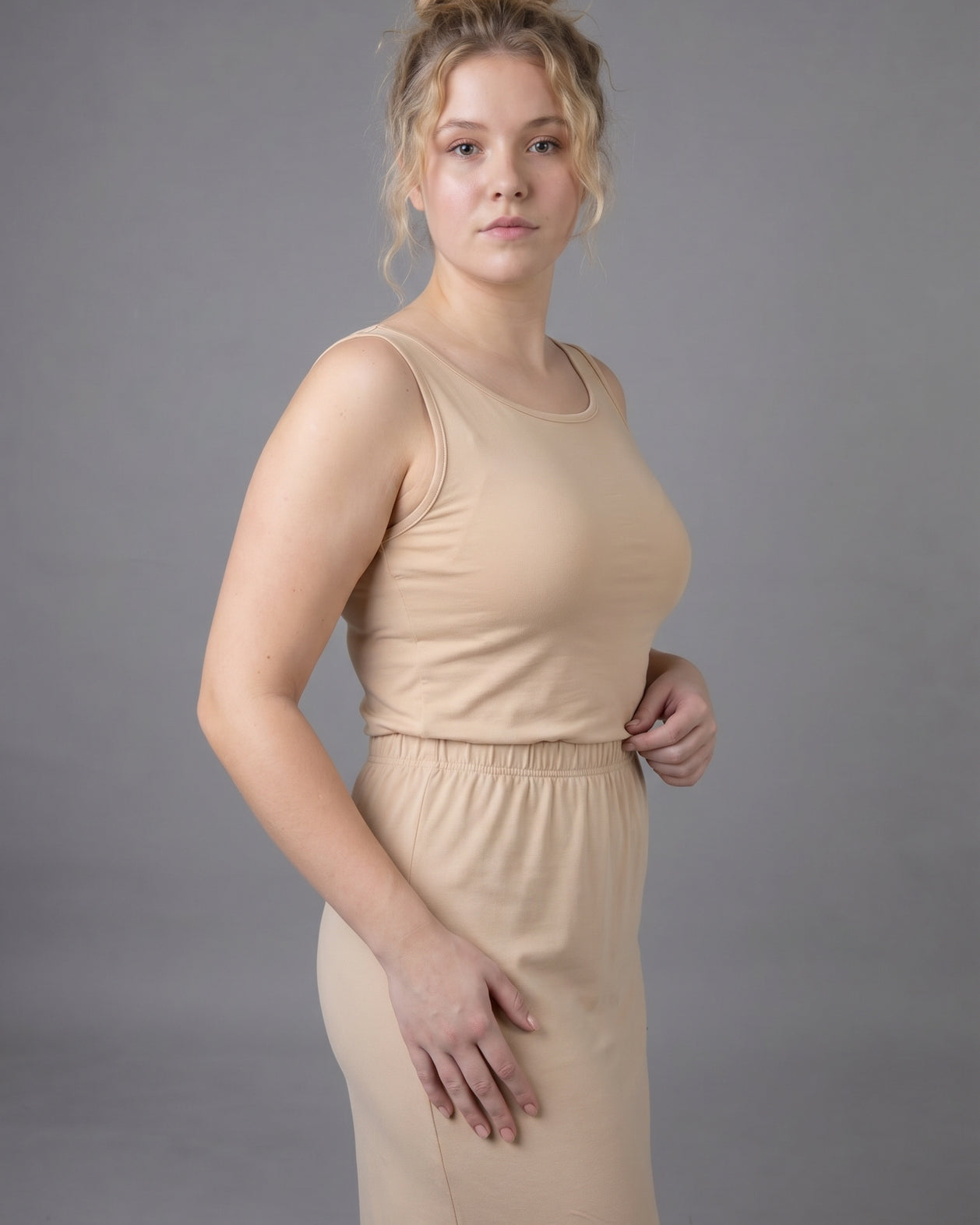 Model wearing Nuggles® Wide Neck Tank in Buff