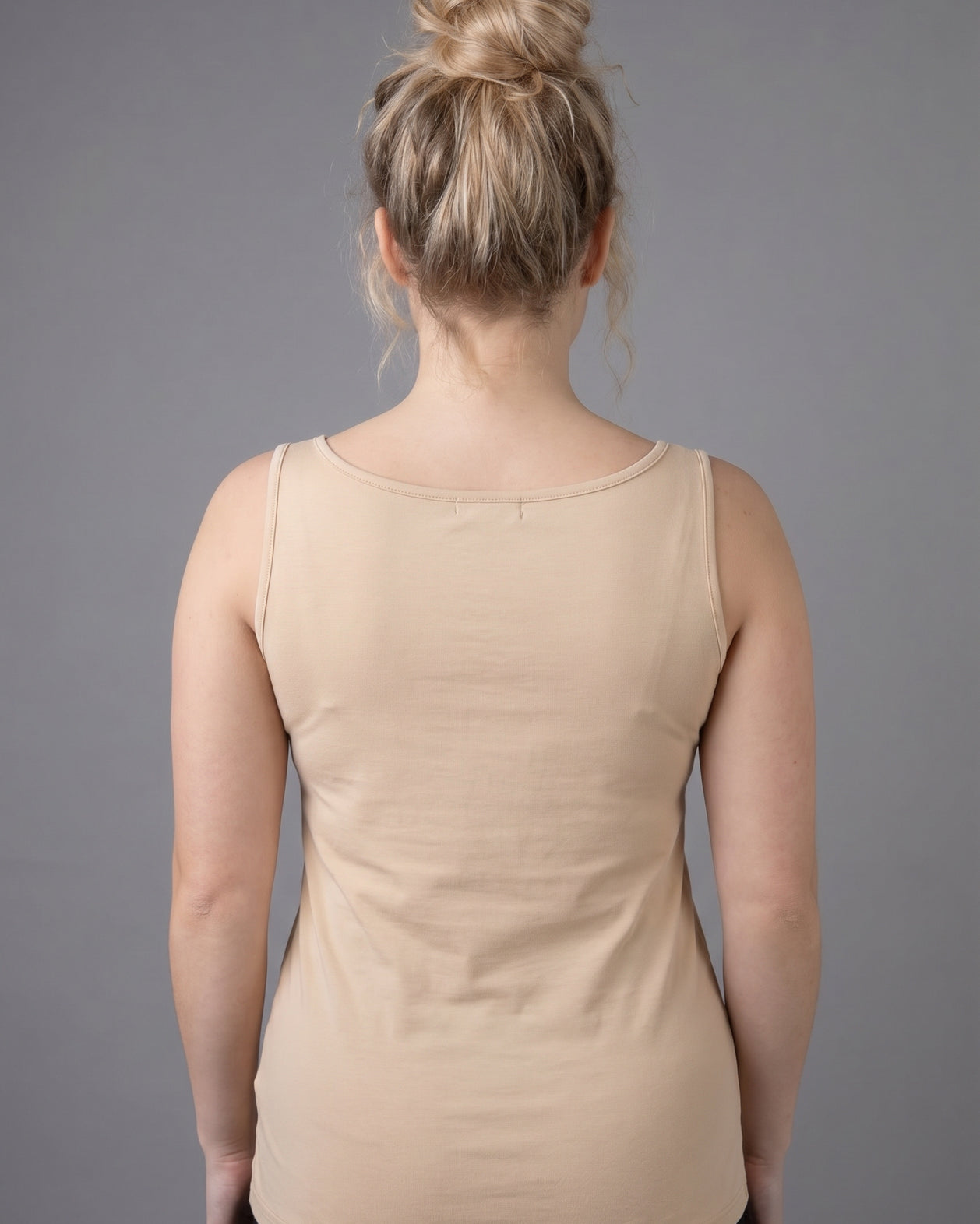 Model wearing Nuggles® Wide Neck Tank in Buff