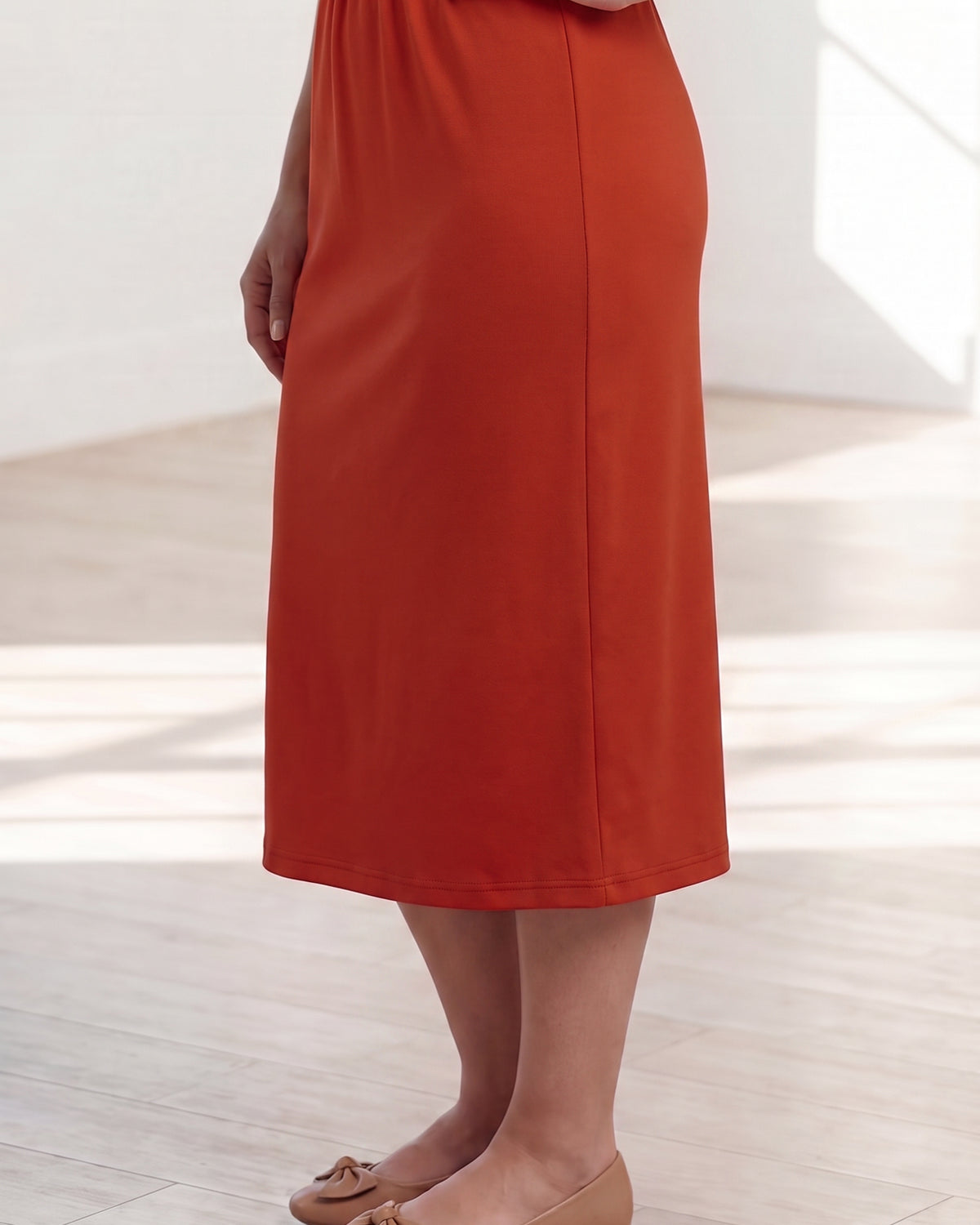 Model wearing Nuggles® 31" Classic Skirt in Burnt Orange