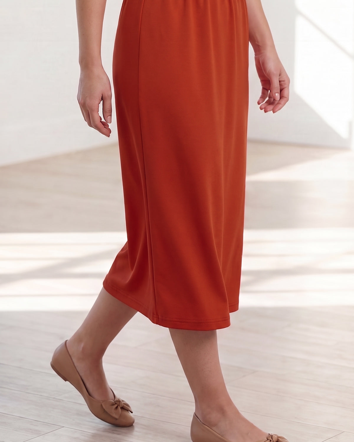Model wearing Nuggles® 31" Classic Skirt in Burnt Orange