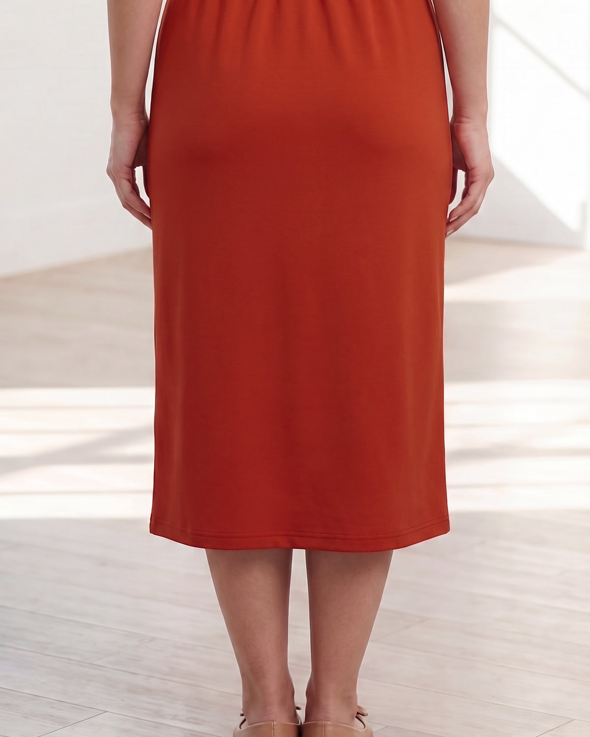 Model wearing Nuggles® 31" Classic Skirt in Burnt Orange