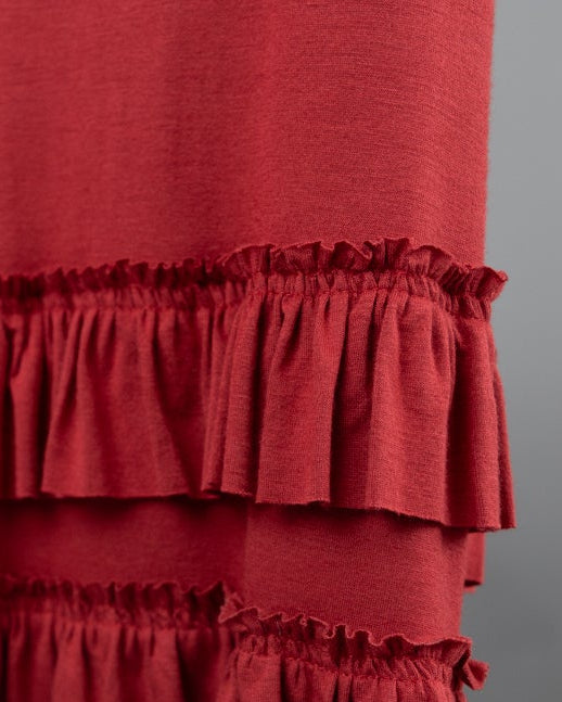 Model wearing Nuggles® Callie Skirt in Brick Red