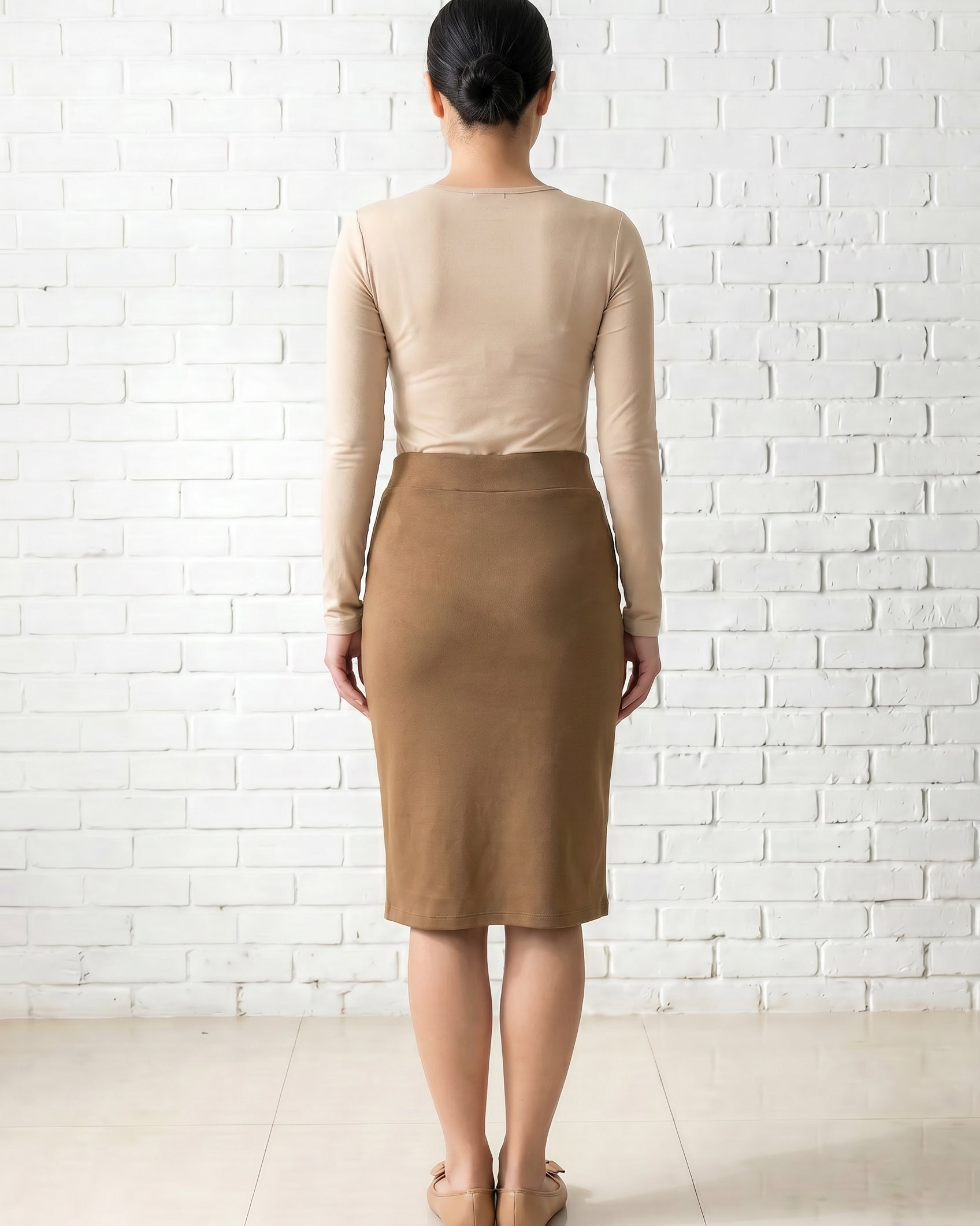 Model wearing Nuggles® 25" Relaxed Skirt in Camel