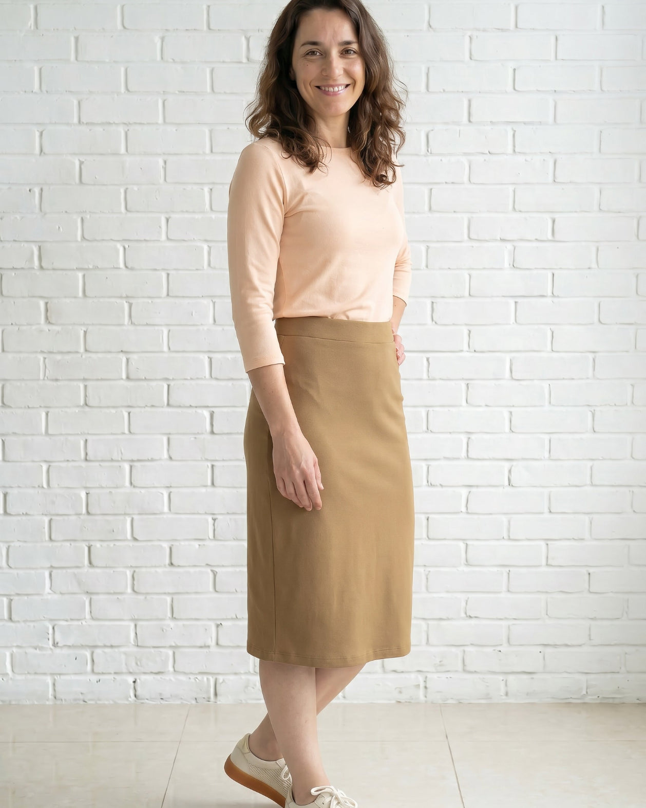 Model wearing Nuggles® 27" Relaxed Skirt in Camel