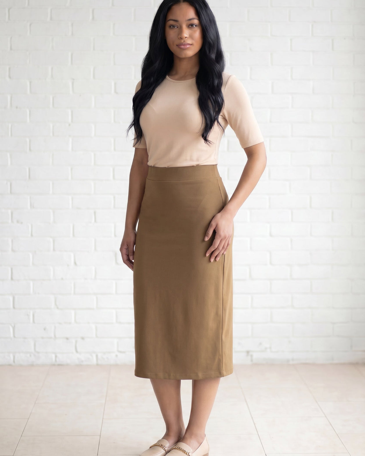 Model wearing Nuggles® 31" Relaxed Skirt in Camel
