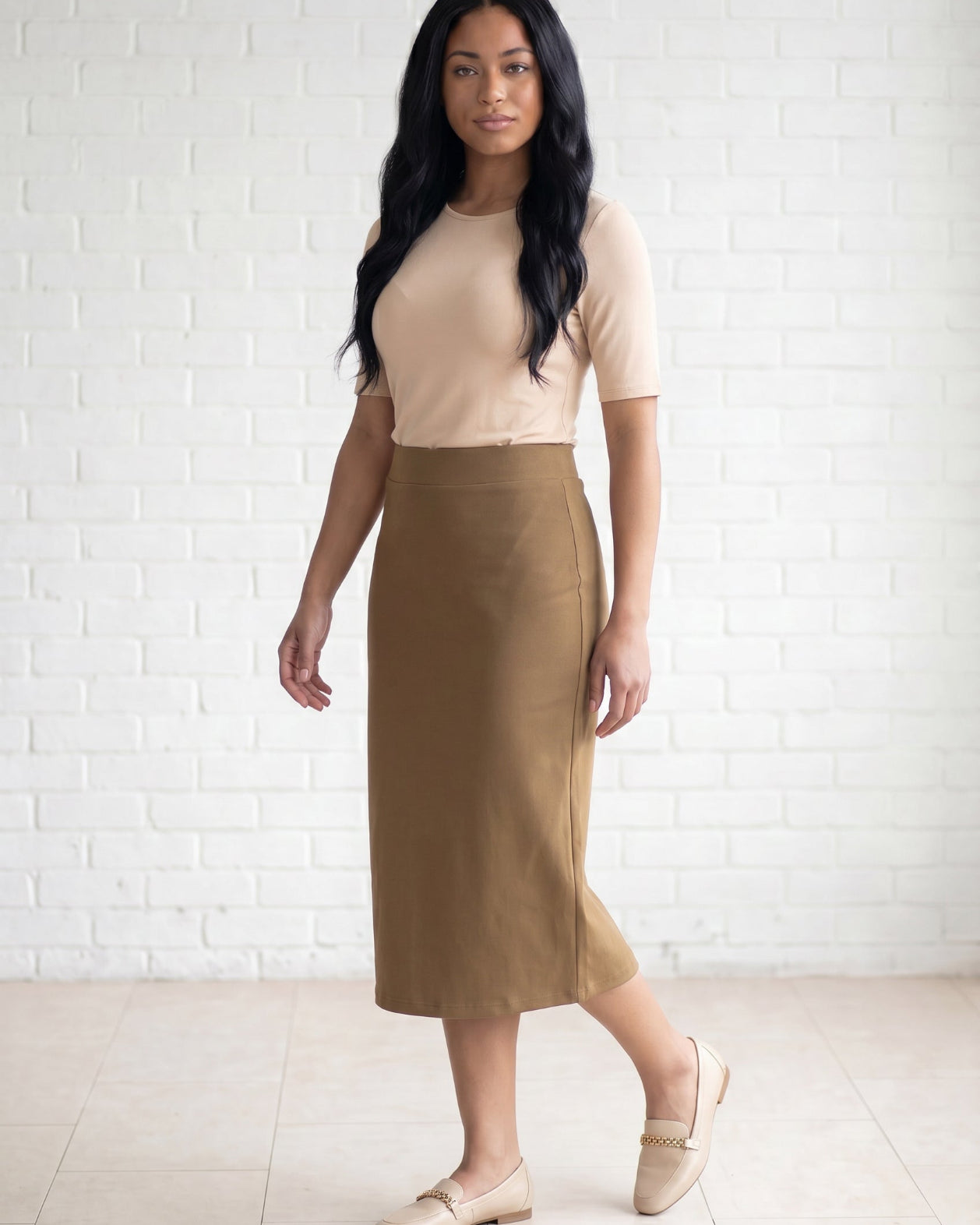 Model wearing Nuggles® 31" Relaxed Skirt in Camel
