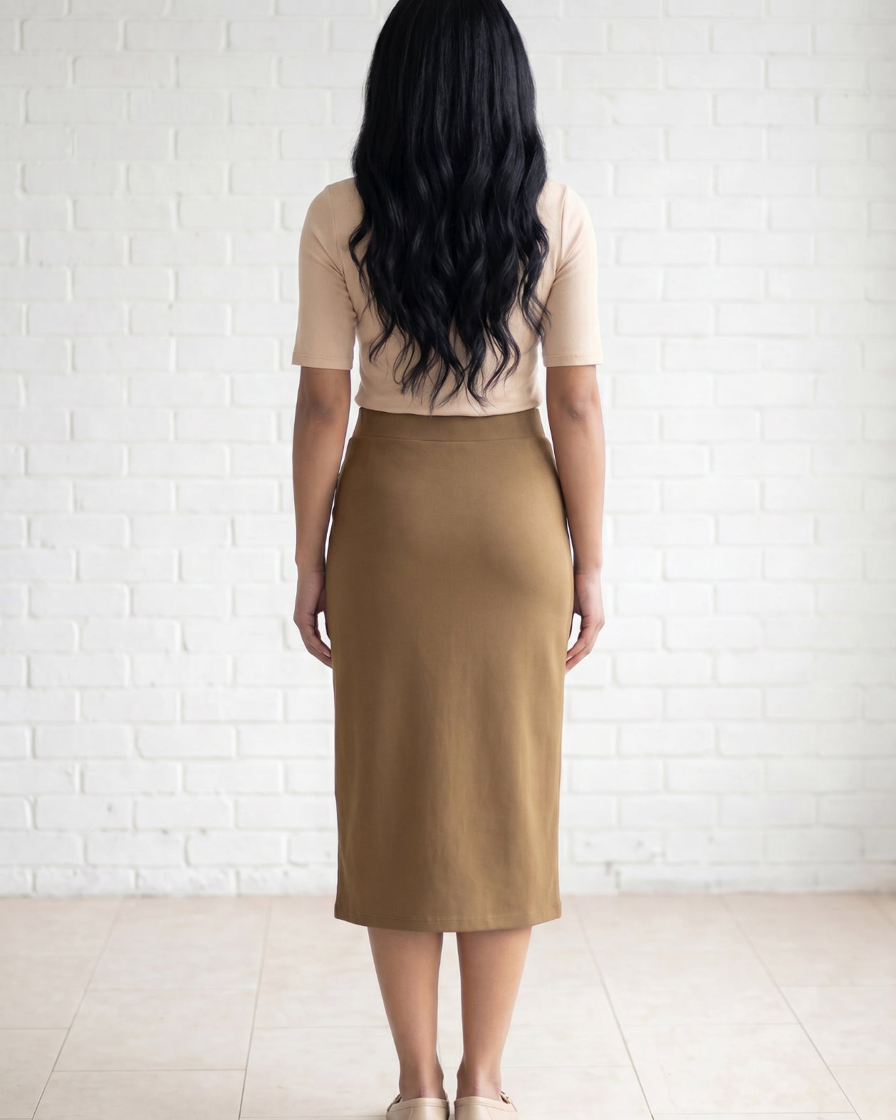 Model wearing Nuggles® 31" Relaxed Skirt in Camel
