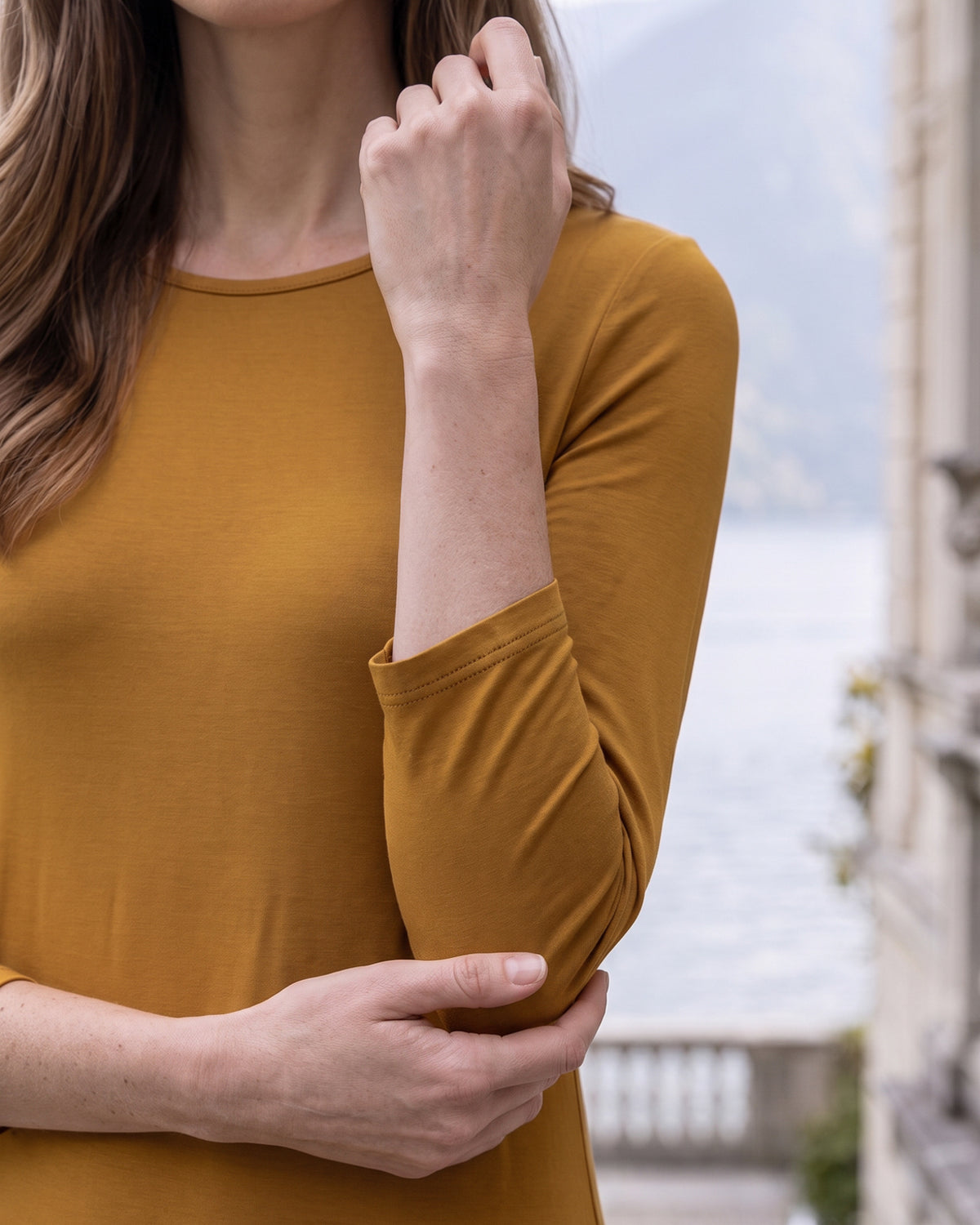Model wearing Nuggles® Maxi Layering Dress in Camel