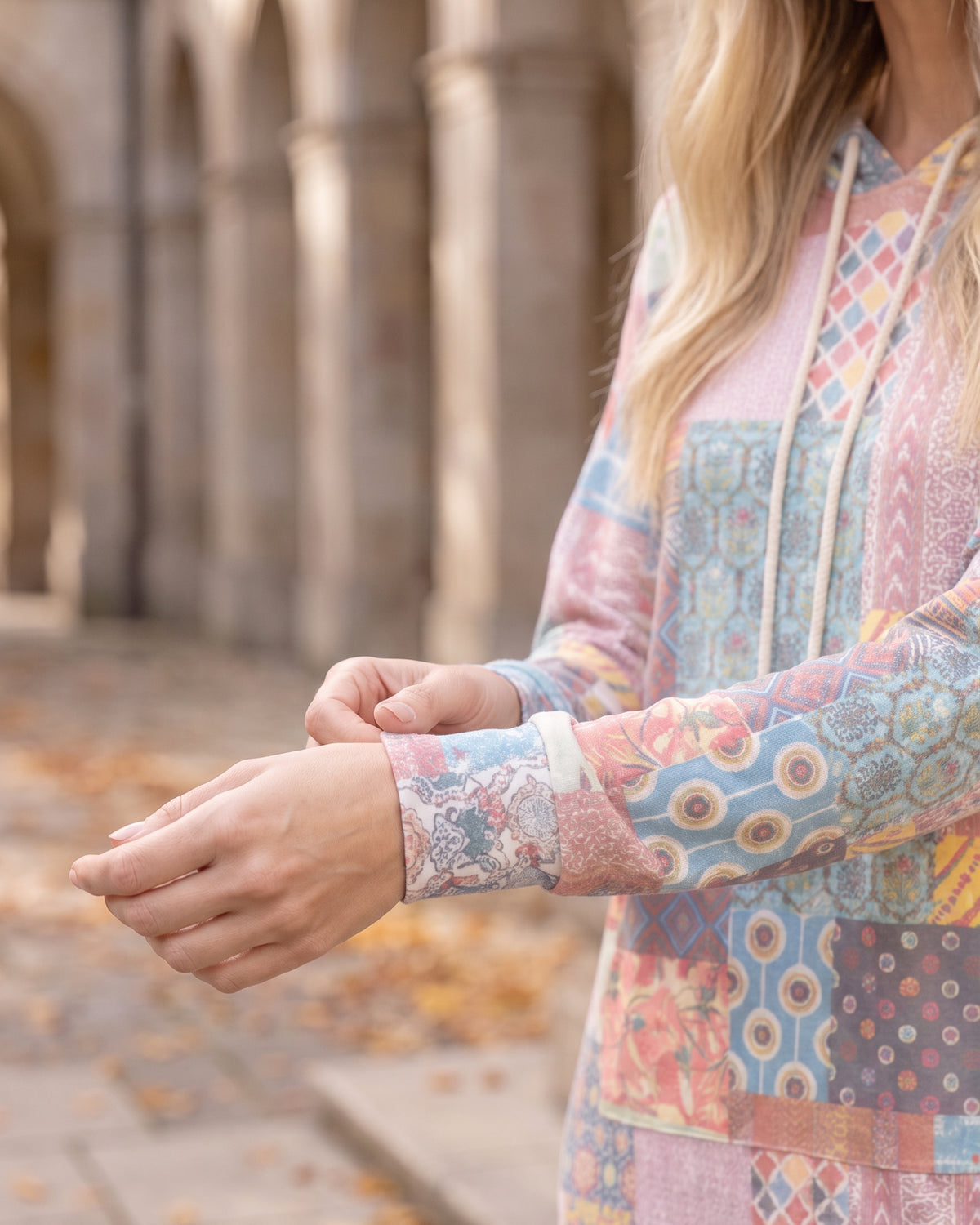 Nuggles® Hoodie Dress in Candy Lane, close-up of the sleeve cuff and patchwork print at the wrist