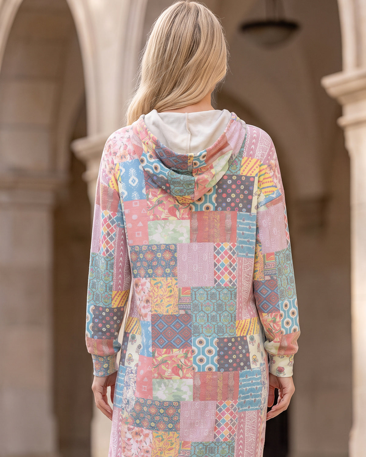 Nuggles® Hoodie Dress in Candy Lane, back view with the hood down over its cream lining
