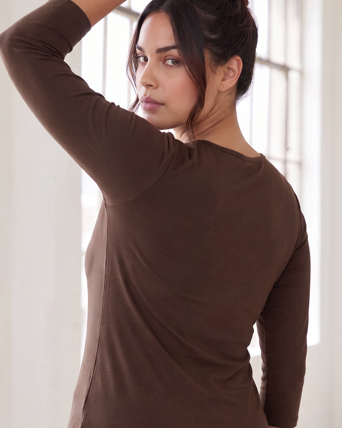 Model wearing Nuggles® Essential 3/4 Tee in Chocolate Brown