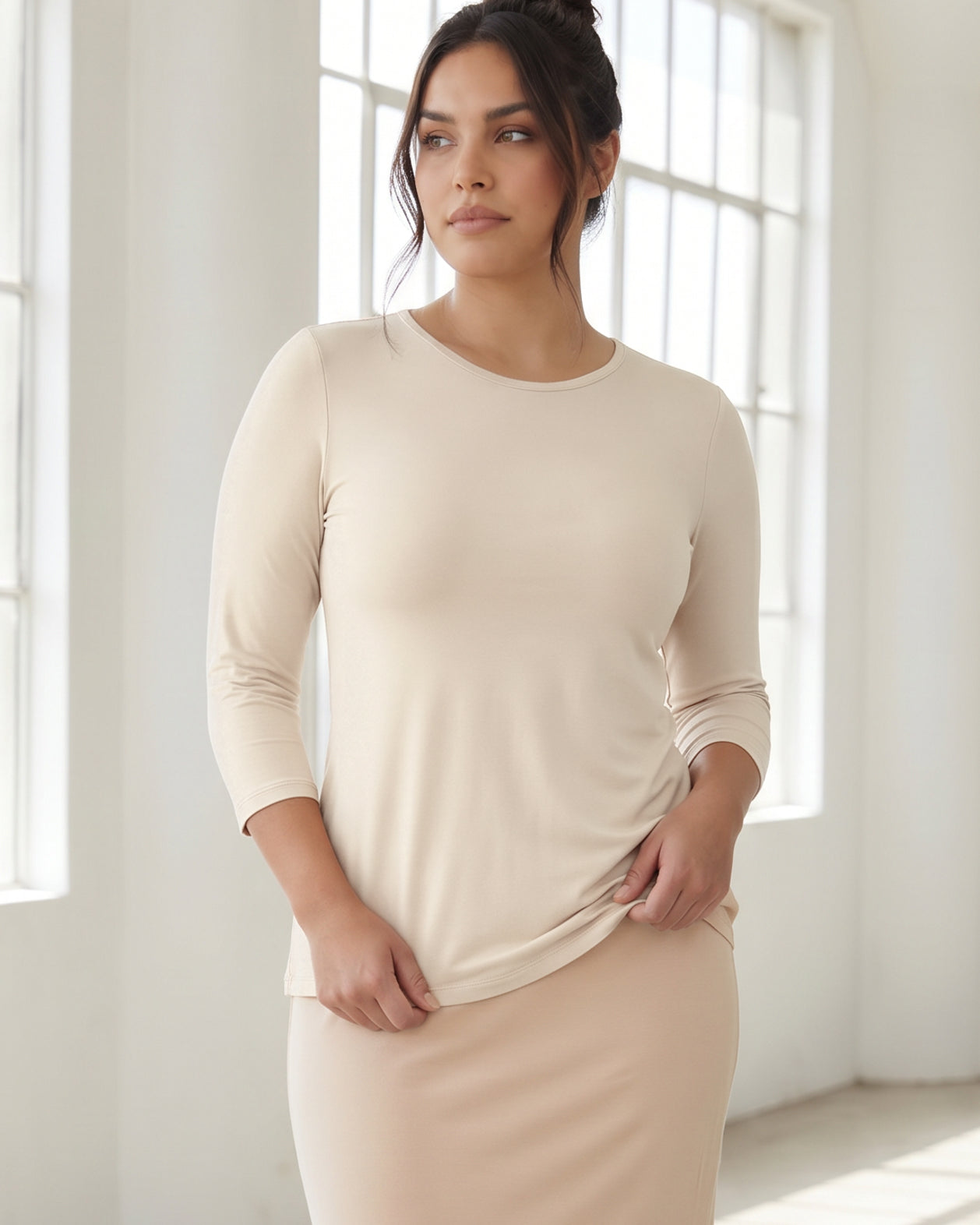 Model wearing Nuggles® 3/4 Essential Tee in Cream