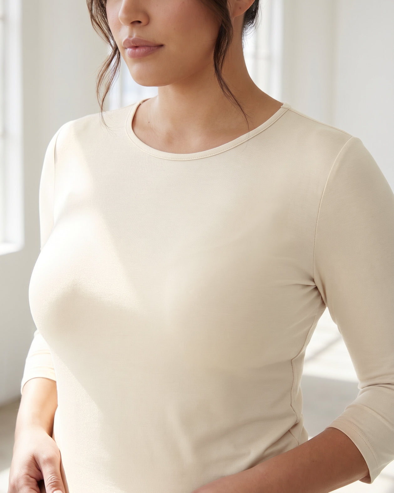 Model wearing Nuggles® 3/4 Essential Tee in Cream
