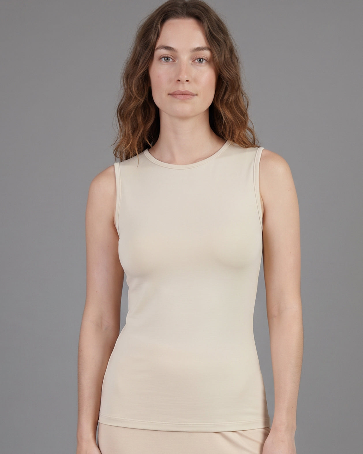 Model wearing Nuggles® Essential Tank in Cream