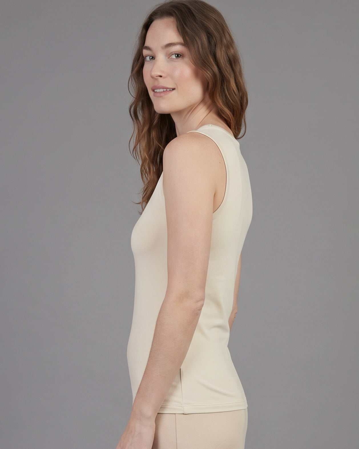 Model wearing Nuggles® Essential Tank in Cream