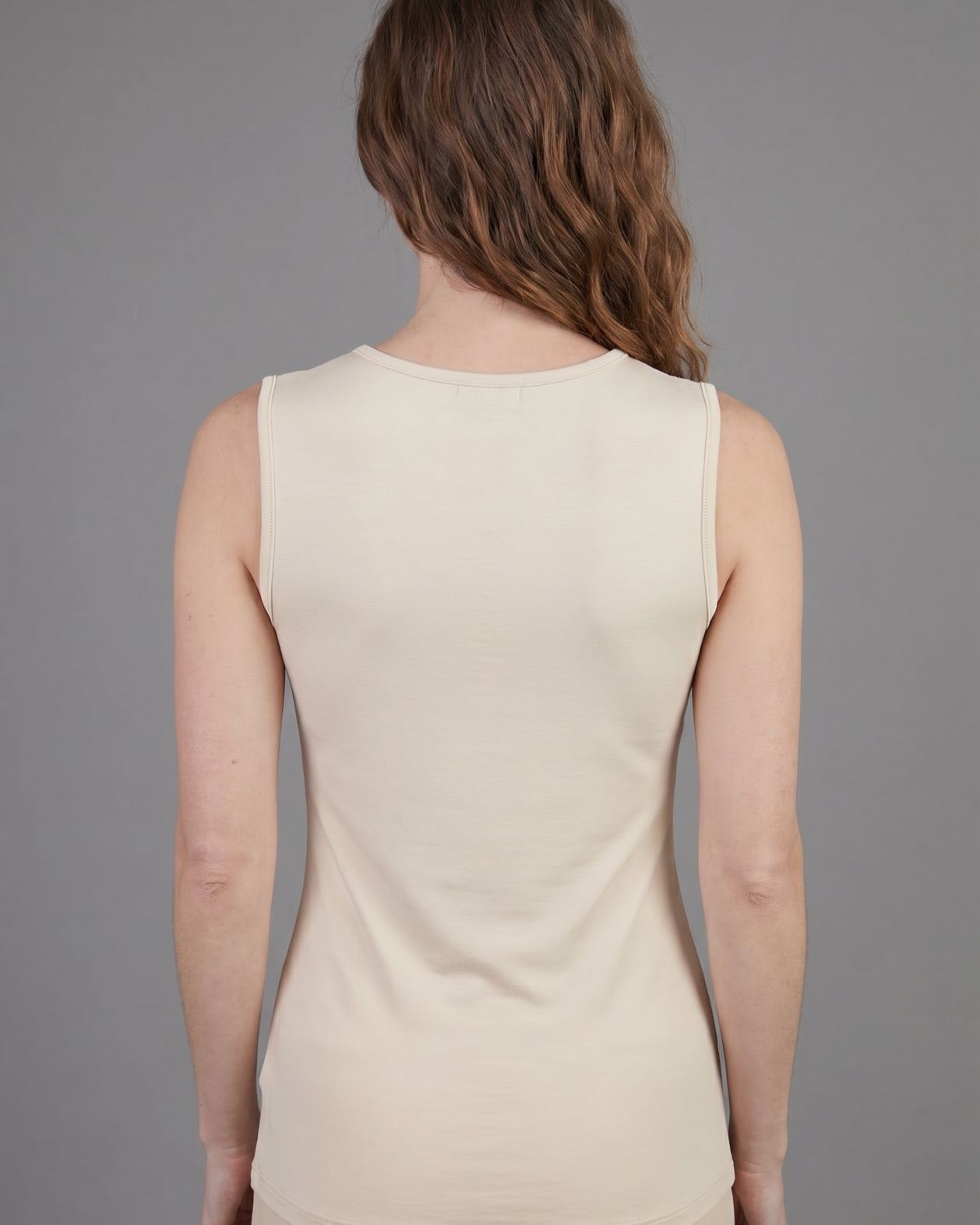 Model wearing Nuggles® Essential Tank in Cream