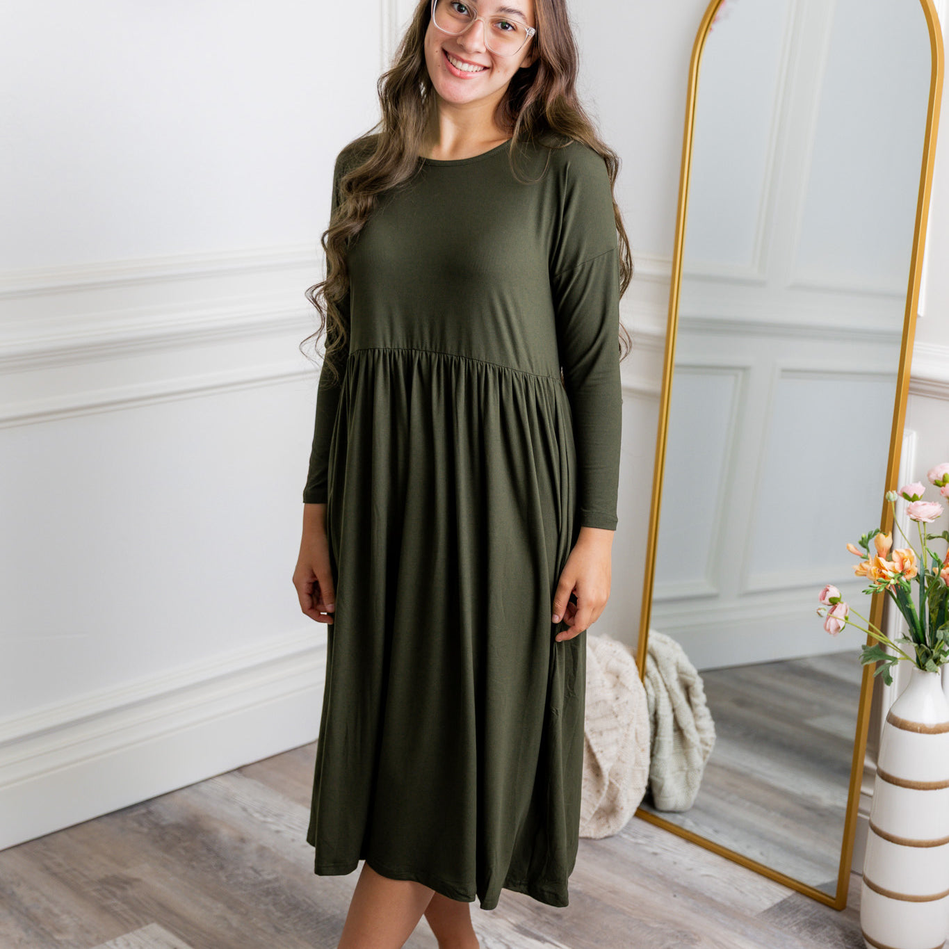 Nuggles® Farah Dress in solid color, modest long sleeve midi dress with empire waist, styled with flats for everyday wear.