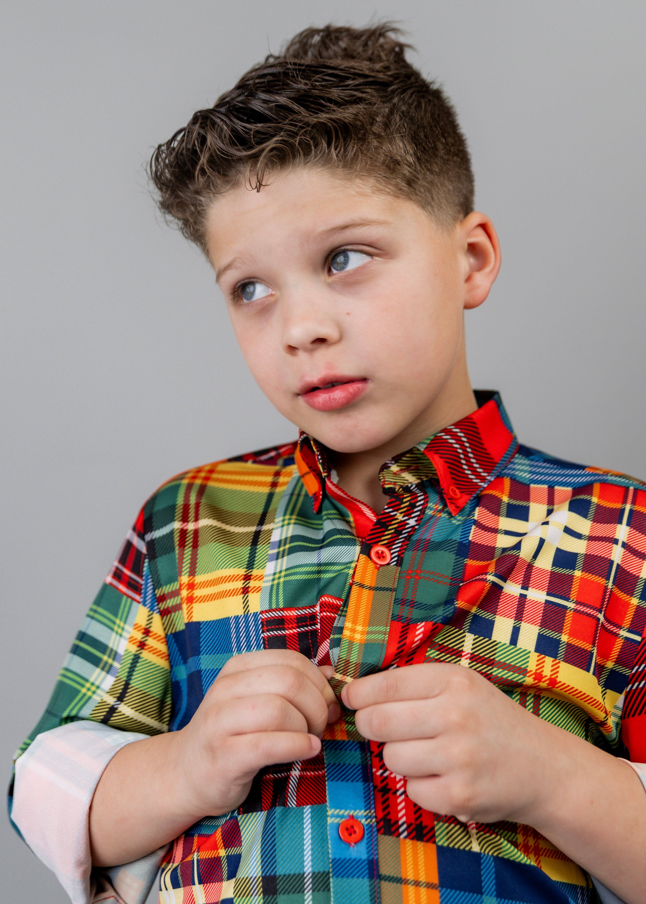 Model wearing Nuggles® Boy's Button Down Shirt in Patch Plaid