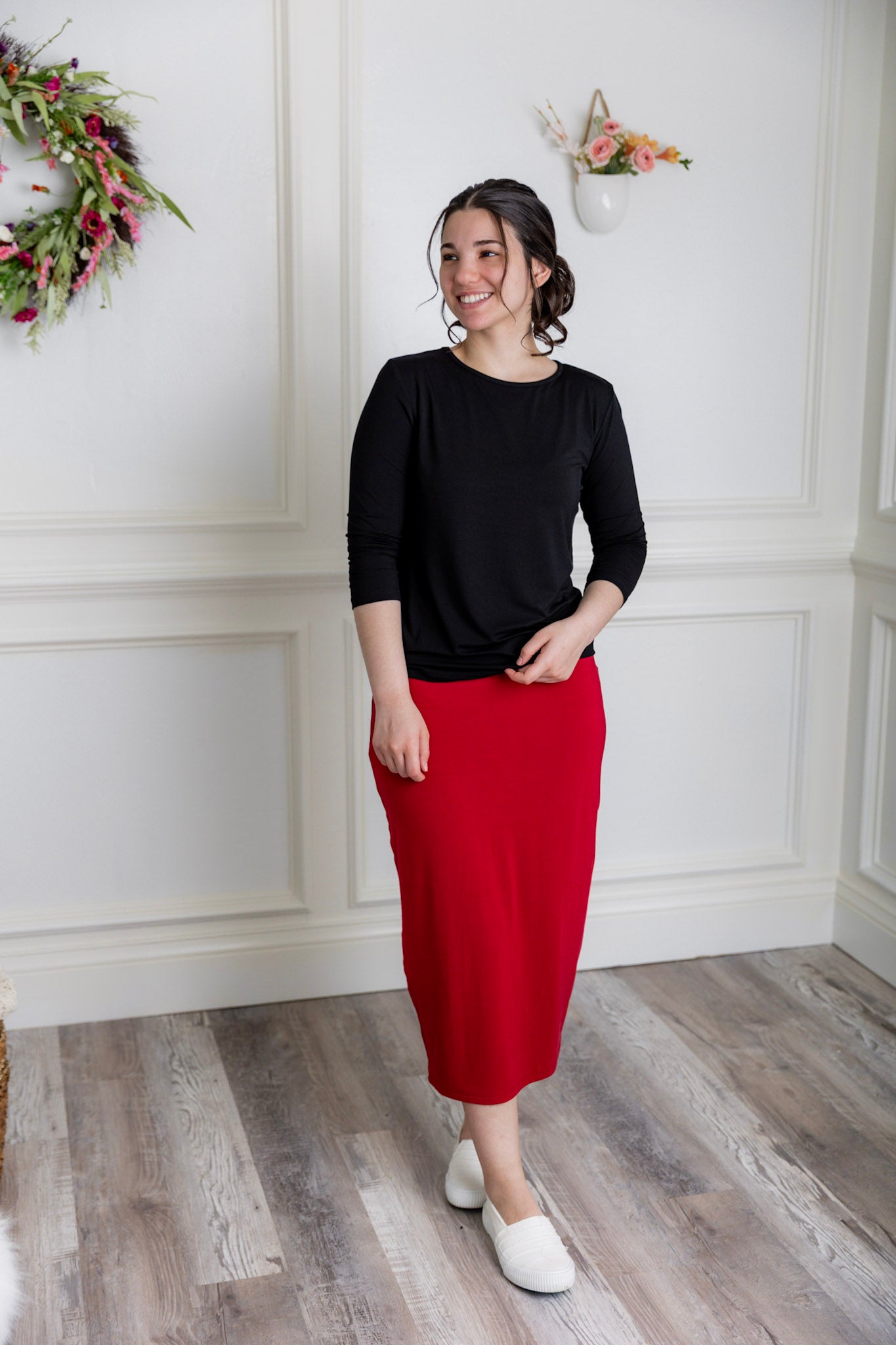 Model showcasing  Nuggles® midi tee skirts in various solid colors, modest 27" and 31" lengths